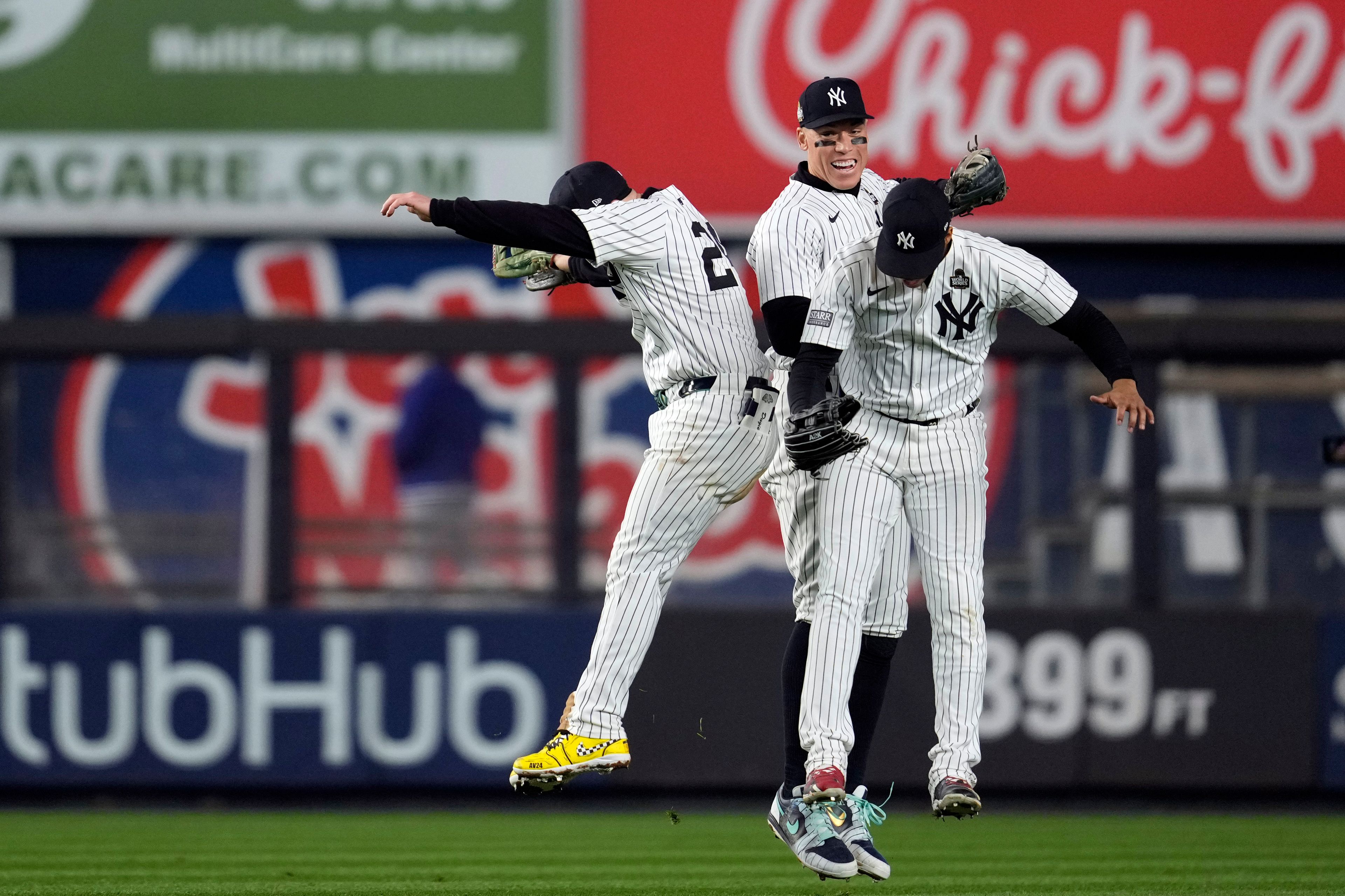 New York Yankees' Alex Verdugo, left, Aaron Judge, center, and Juan Soto celebrate after Game 4 of the baseball World Series against the Los Angeles Dodgers, Tuesday, Oct. 29, 2024, in New York. The Yankees won 11-4. (AP Photo/Godofredo A. Vásquez)