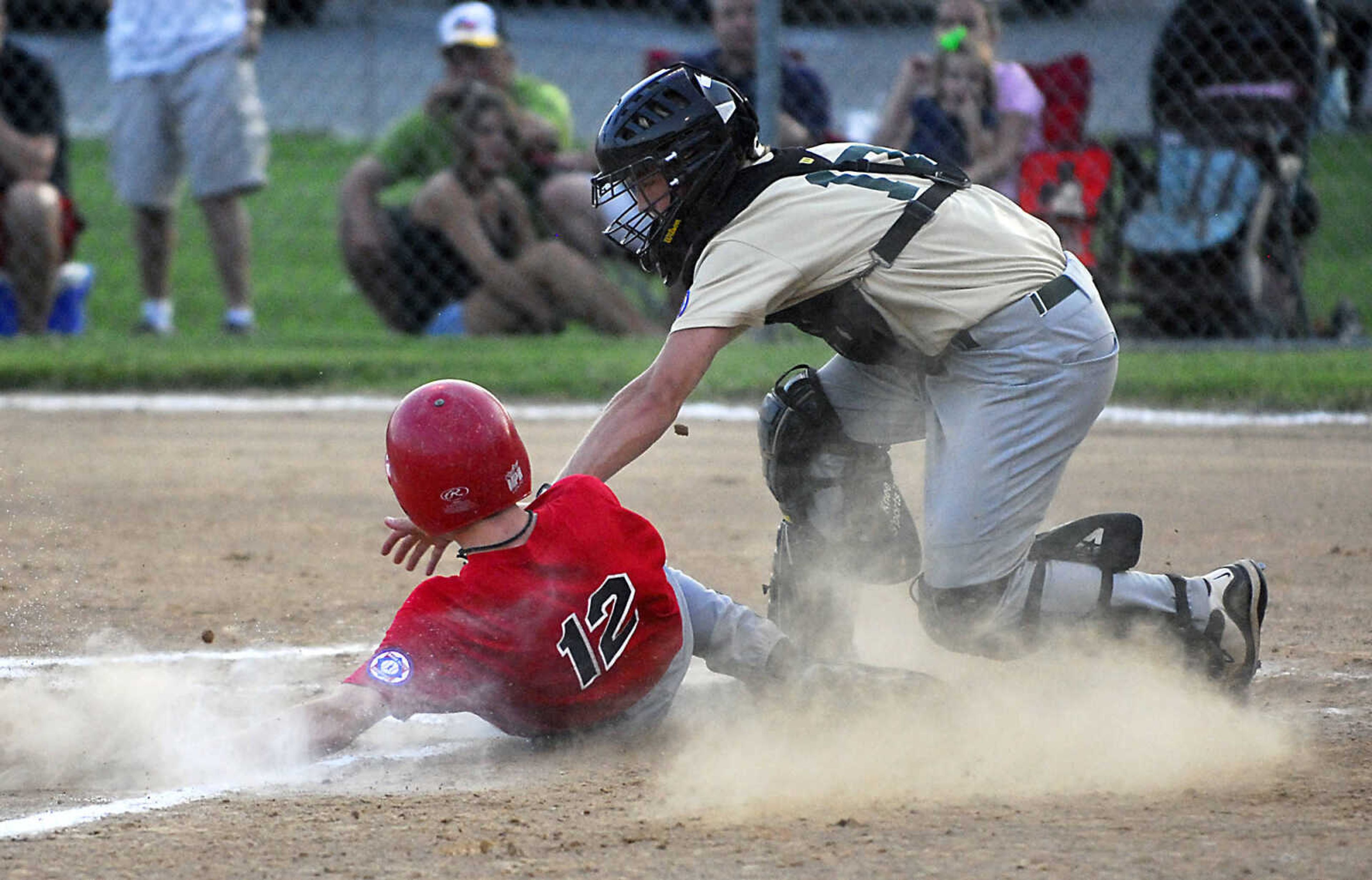 KIT DOYLE ~ kdoyle@semissourian.com
New Madrid catcher Brandon Bennett tags out Jackson's Alex Beussink on a failed squeeze attempt Friday, July 24, 2009, at Jackson City Park.