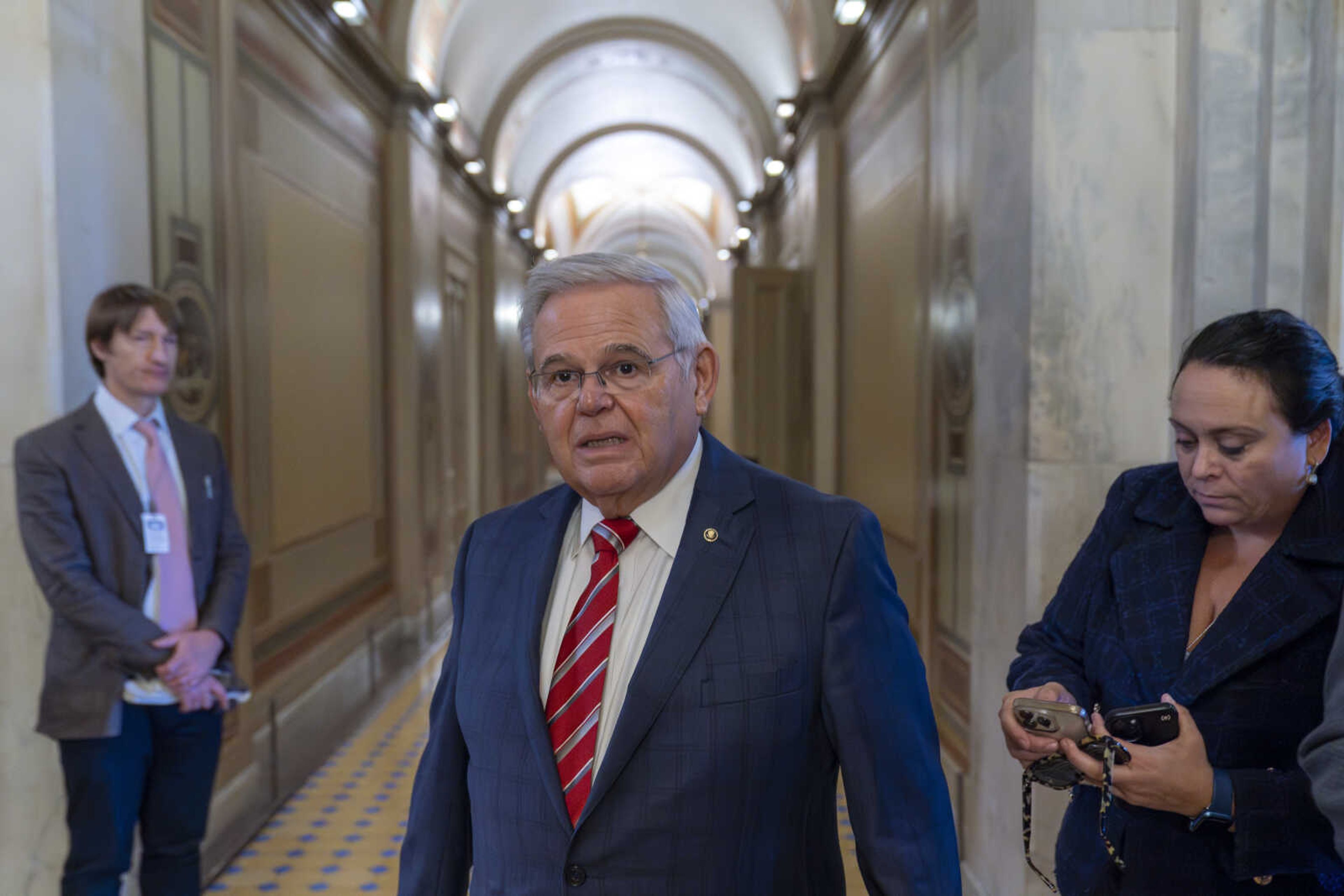 Sen. Bob Menendez, D-N.J., departs the Senate floor in the Capitol on Thursday in Washington.