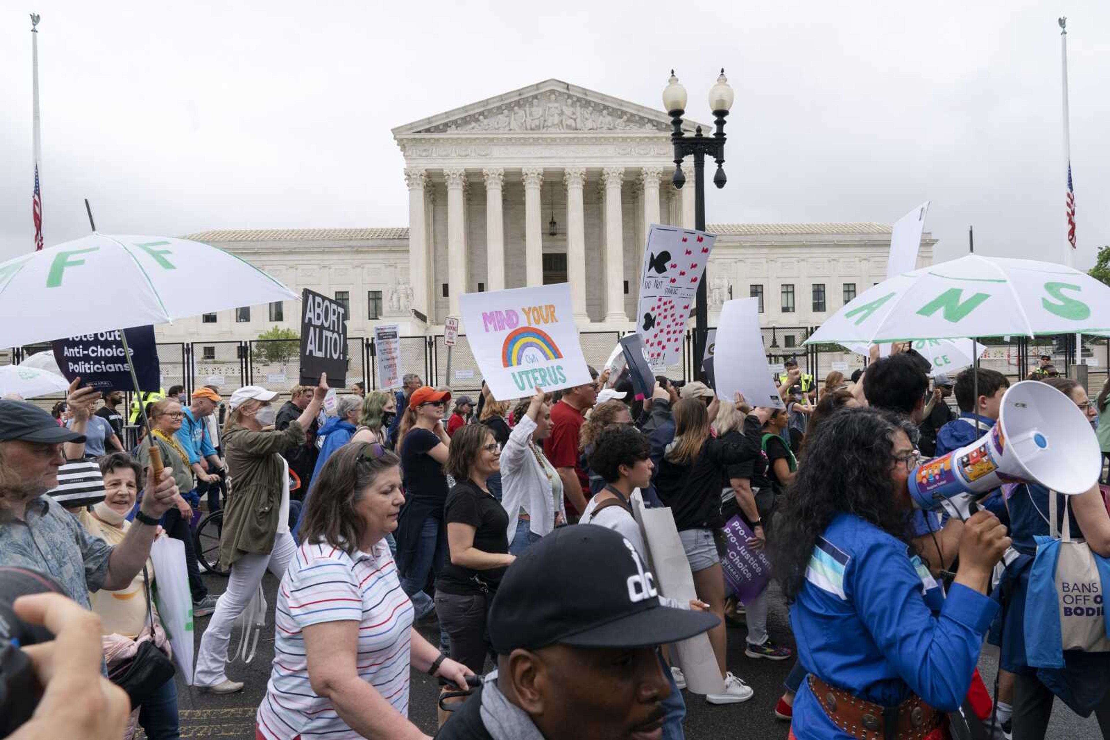 Abortion-rights demonstrators coming from the Washington Monument march past the Supreme Court on May 14 in Washington.