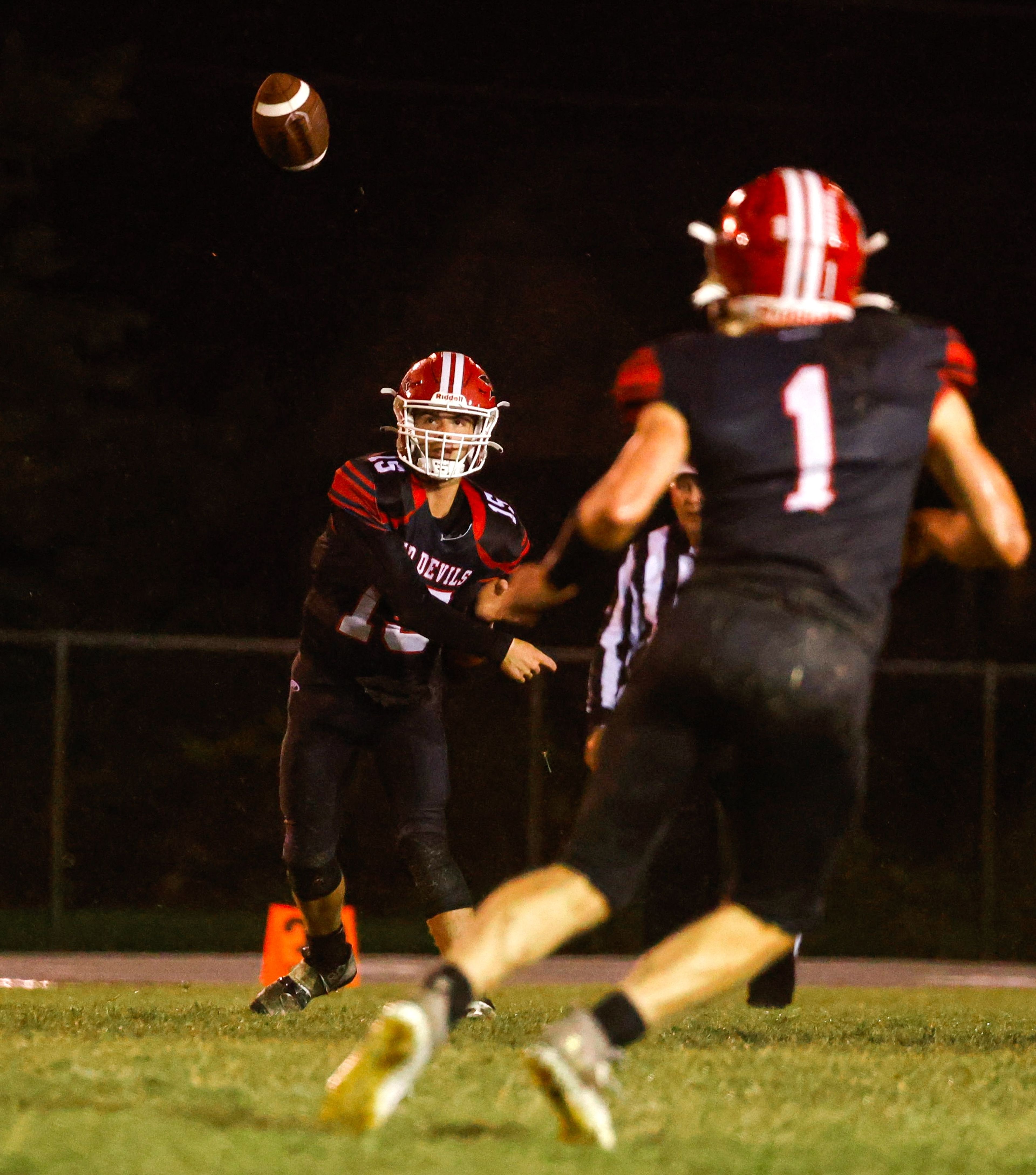 Chaffee's Leyton Hanback (left) sends a pass during a Friday, September 27, 2024 game between the Chaffee Red Devils and the Principia Panthers at Chaffee High School in Chaffee, Mo. Principia defeated Chaffee, 14-6.