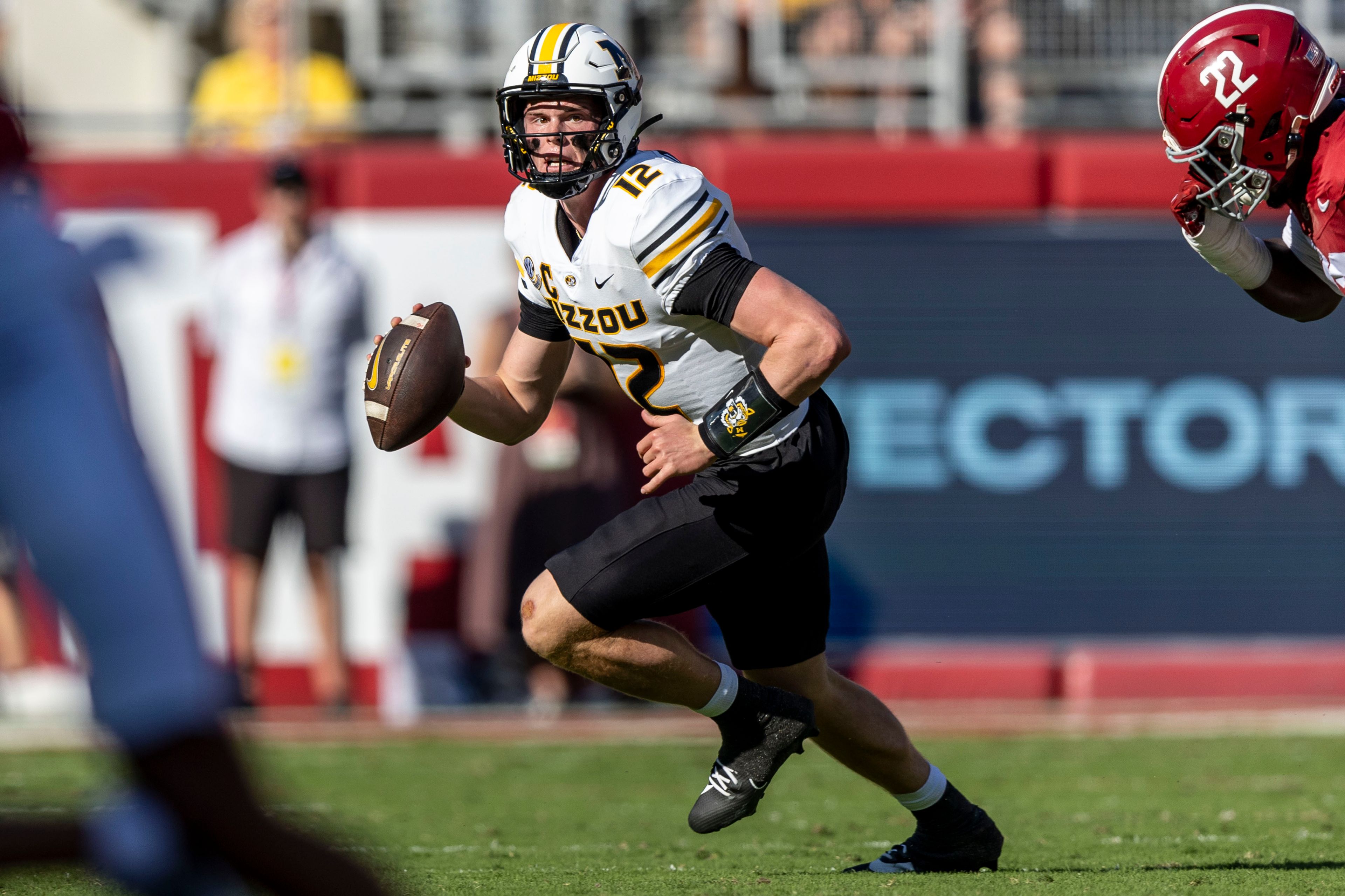 Missouri quarterback Brady Cook (12) runs during the first half of an NCAA college football game against Alabama, Saturday, Oct. 26, 2024, in Tuscaloosa, Ala. (AP Photo/Vasha Hunt)