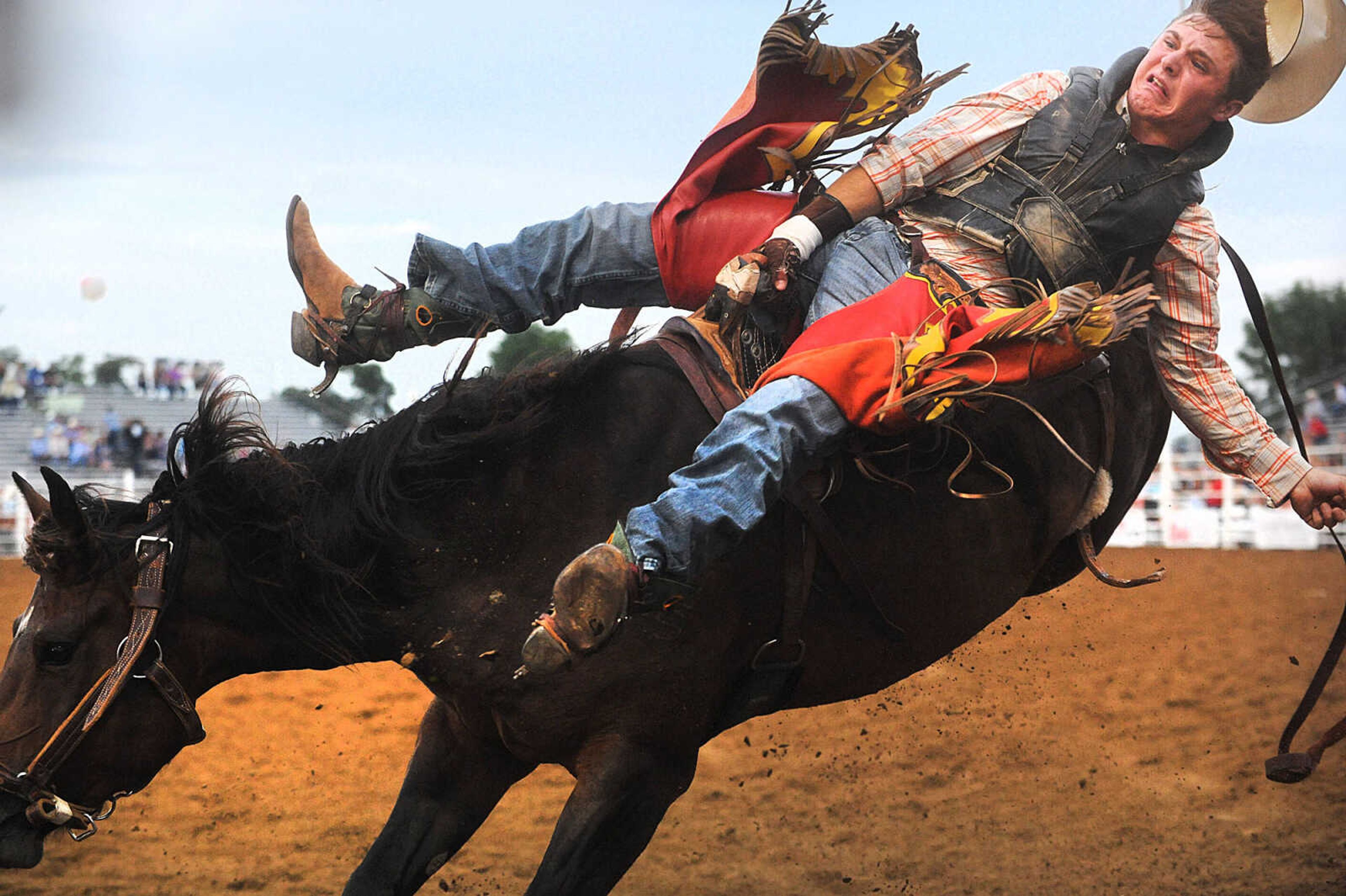 LAURA SIMON ~ lsimon@semissourian.com

Tanner Phipps competes in bareback riding during the opening night of the Sikeston Jaycee Bootheel Rodeo, Wednesday, Aug. 6, 2014. The rodeo runs through Saturday.