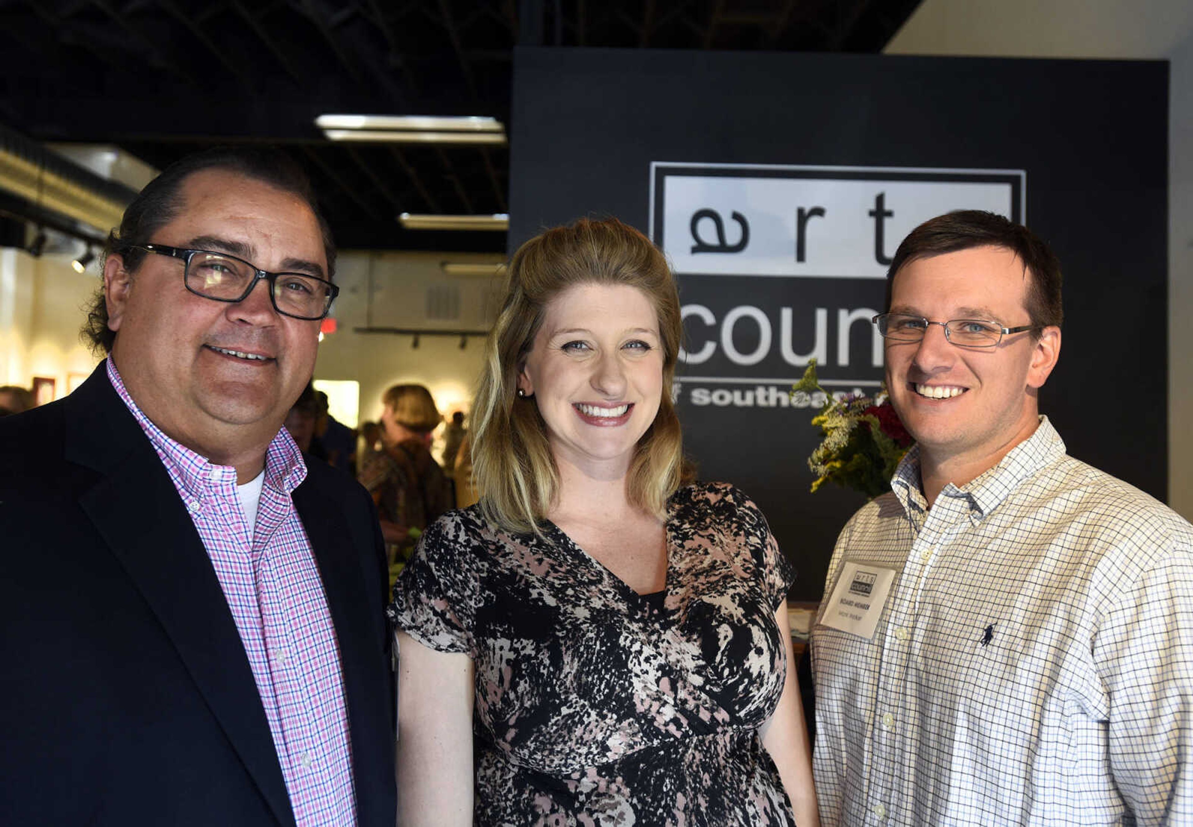 LAURA SIMON ~ lsimon@semissourian.com

Jerry McCearley, left, Murielle Gaither, center and Mark Welker pose for a photo during the grand opening reception for the 4th annual Members Exhibit at the Arts Council of Southeast Missouri in its new location at 16 North Spanish Street in downtown Cape Girardeau on Friday, Sept. 2, 2016.