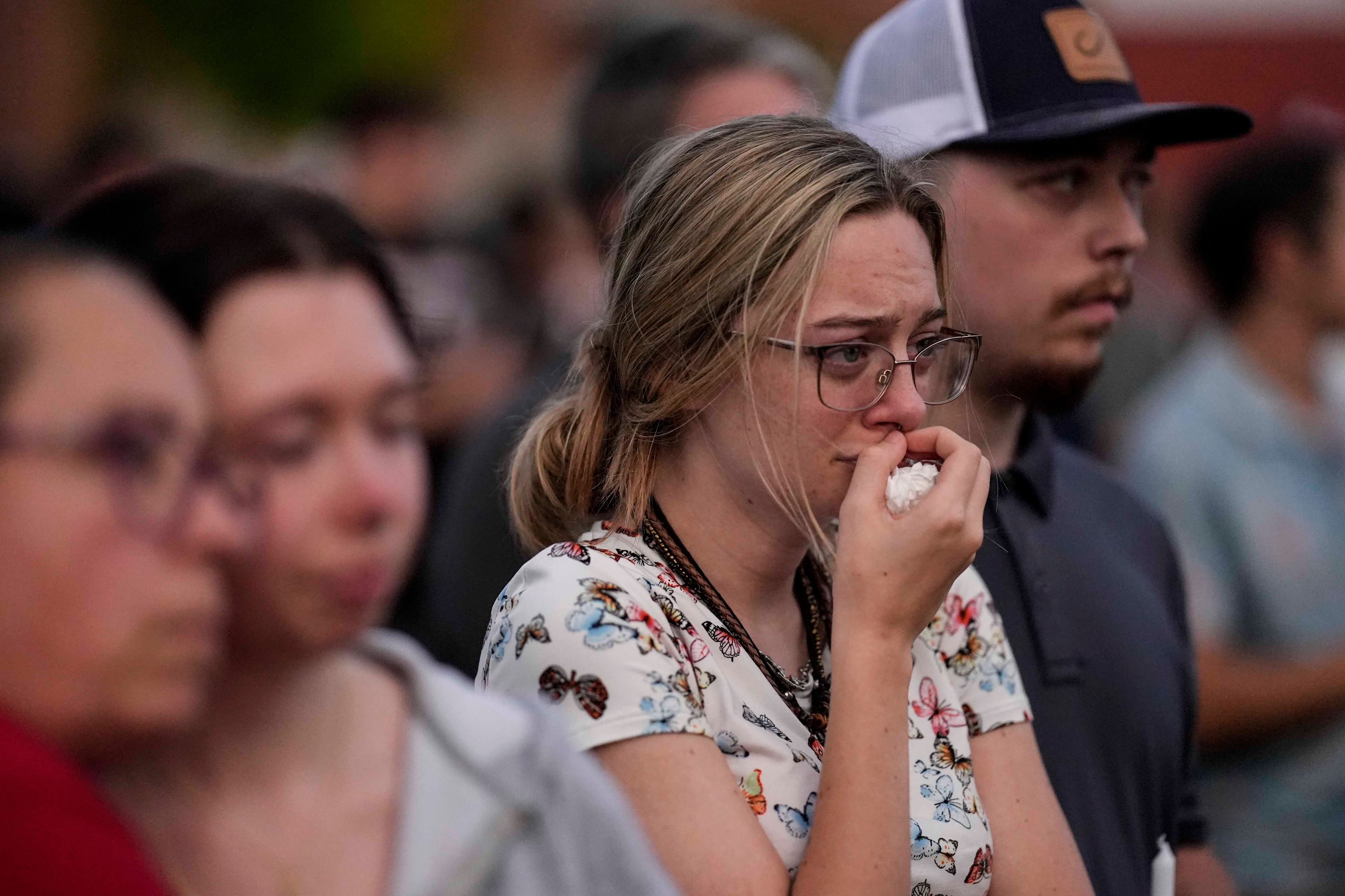 Mourners pray during a candlelight vigil for the slain students and teachers at Apalachee High School, Wednesday, Sept. 4, 2024, in Winder, Ga. (AP Photo/Mike Stewart)