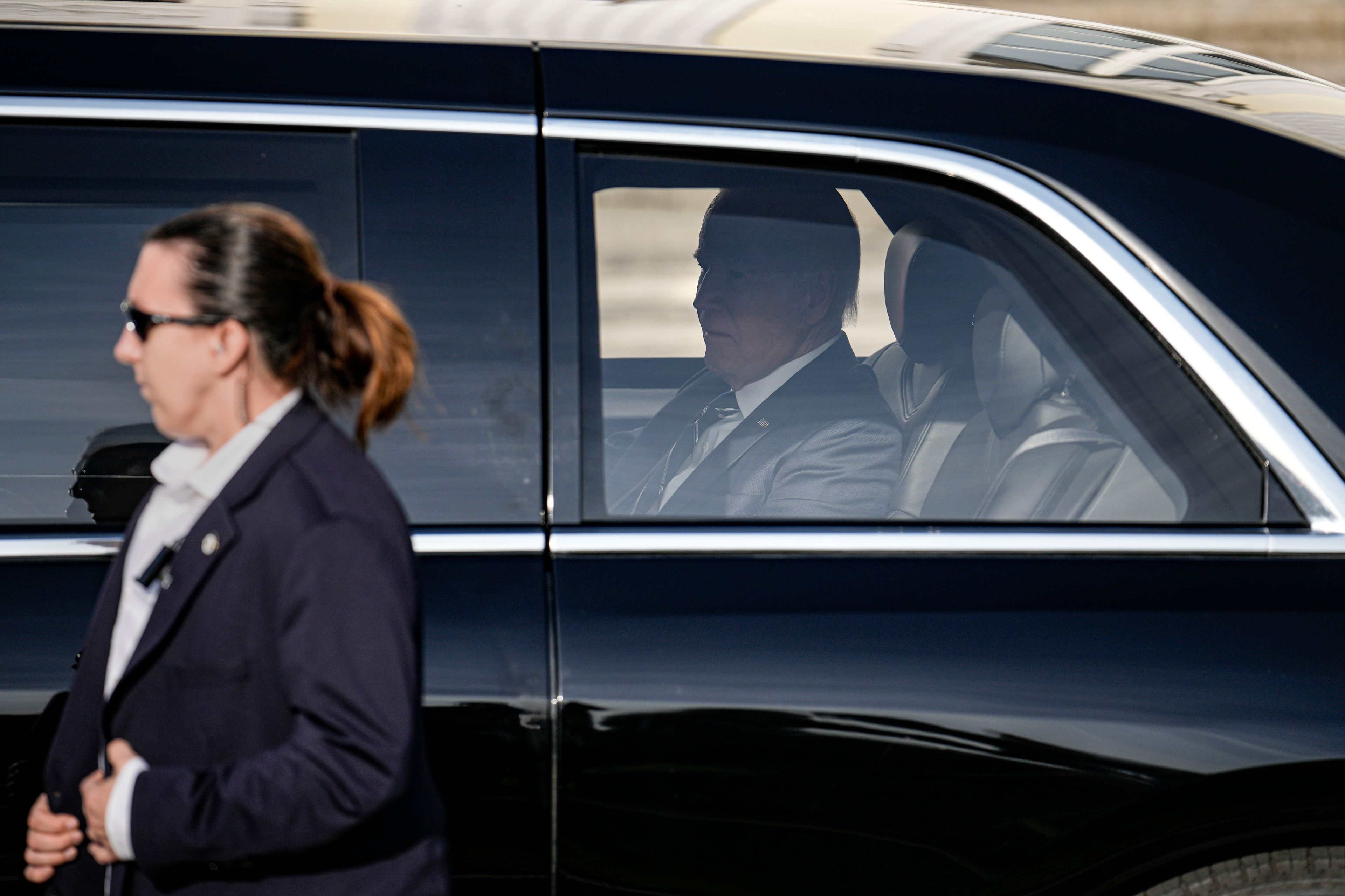 President Joe Biden arrives in his car with the Secret Service for the welcoming ceremony at Bellevue Palace in Berlin, Germany, Friday, Oct. 18, 2024. (AP Photo/Ebrahim Noroozi)