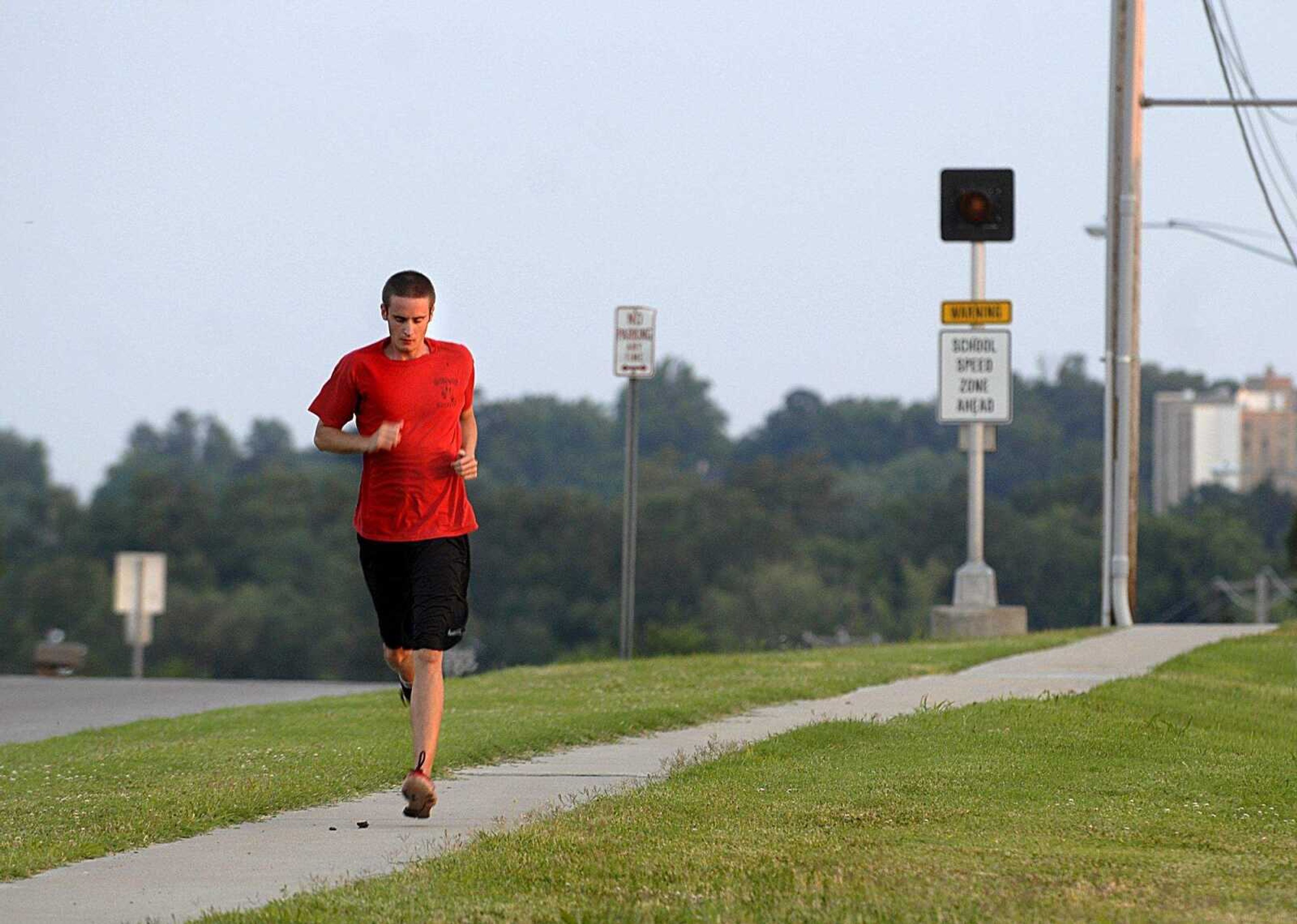 AARON EISENHAUER ~ aeisenhauer@semissourian.com
John Reecht, a Southeast Missouri State University junior and resident of Cape Place Apartments, jogs down North Sprigg Street on Wednesday, June 11, 2008.