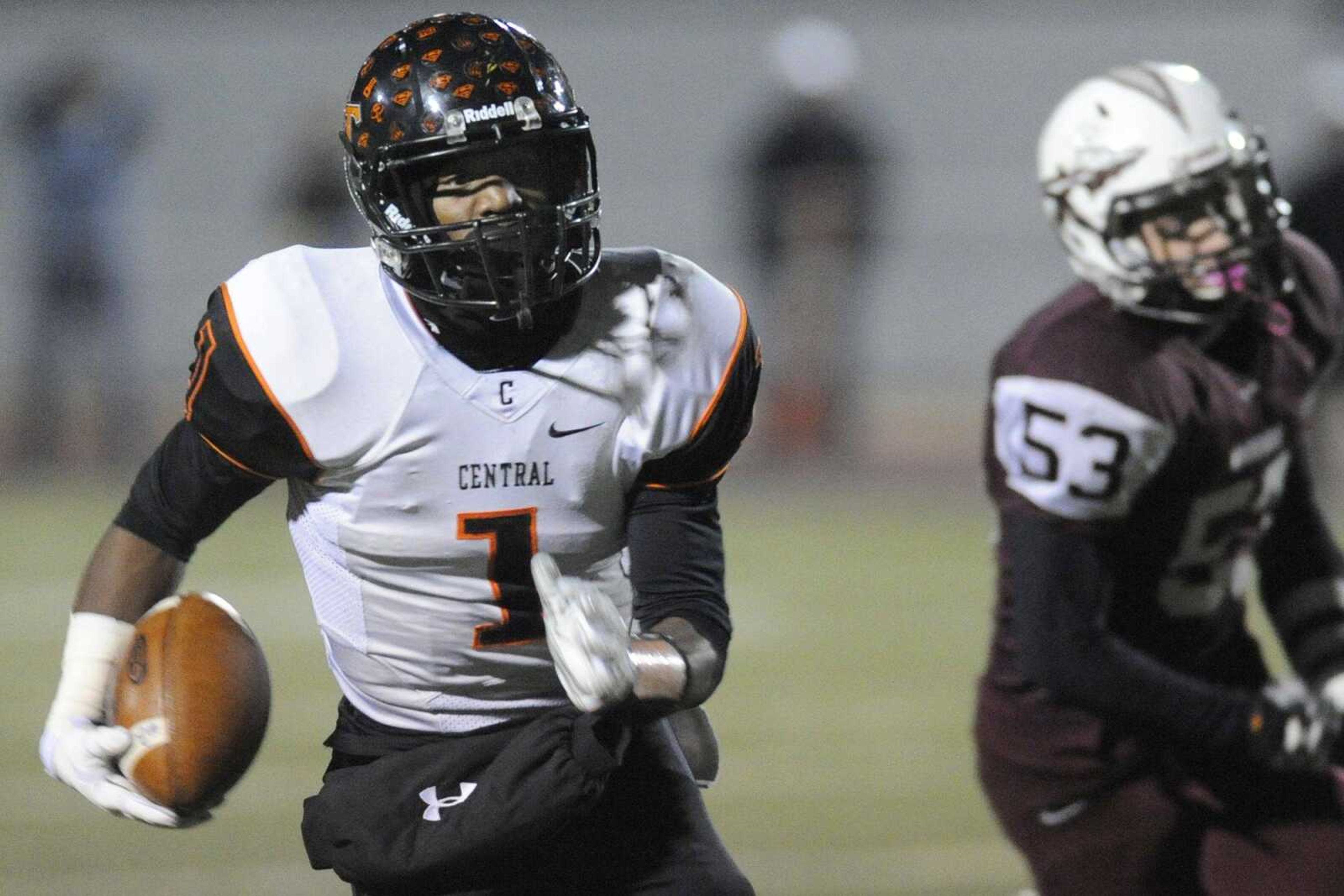 Central's Al Young carries in the first quarter of the Class 4 semifinal against St. Charles West Friday, Nov. 21, 2014 in St. Charles, Missouri. (Glenn Landberg)