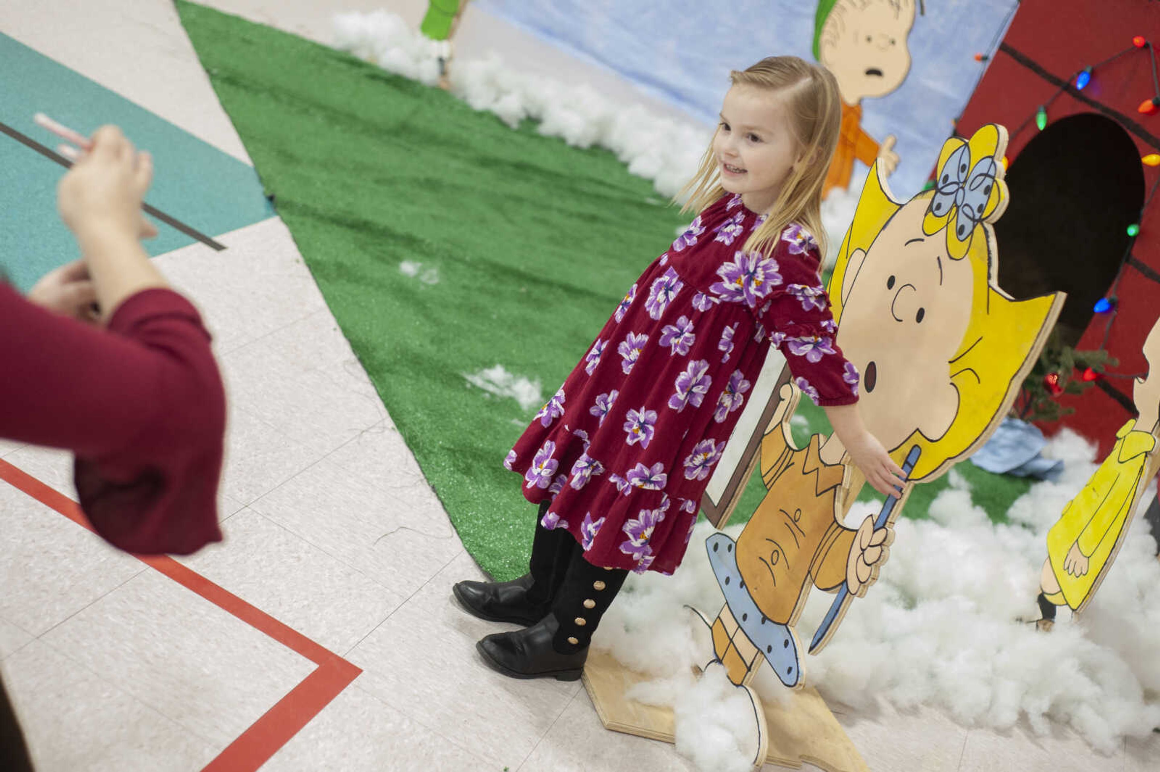 Alabama Gianesin, 4, of Cape Girardeau has her picture taken by her mother Erica Gianesin during the Cape Parks &amp; Recreation Foundation's Breakfast with Santa event Saturday, Dec. 14, 2019, at the Osage Centre in Cape Girardeau.