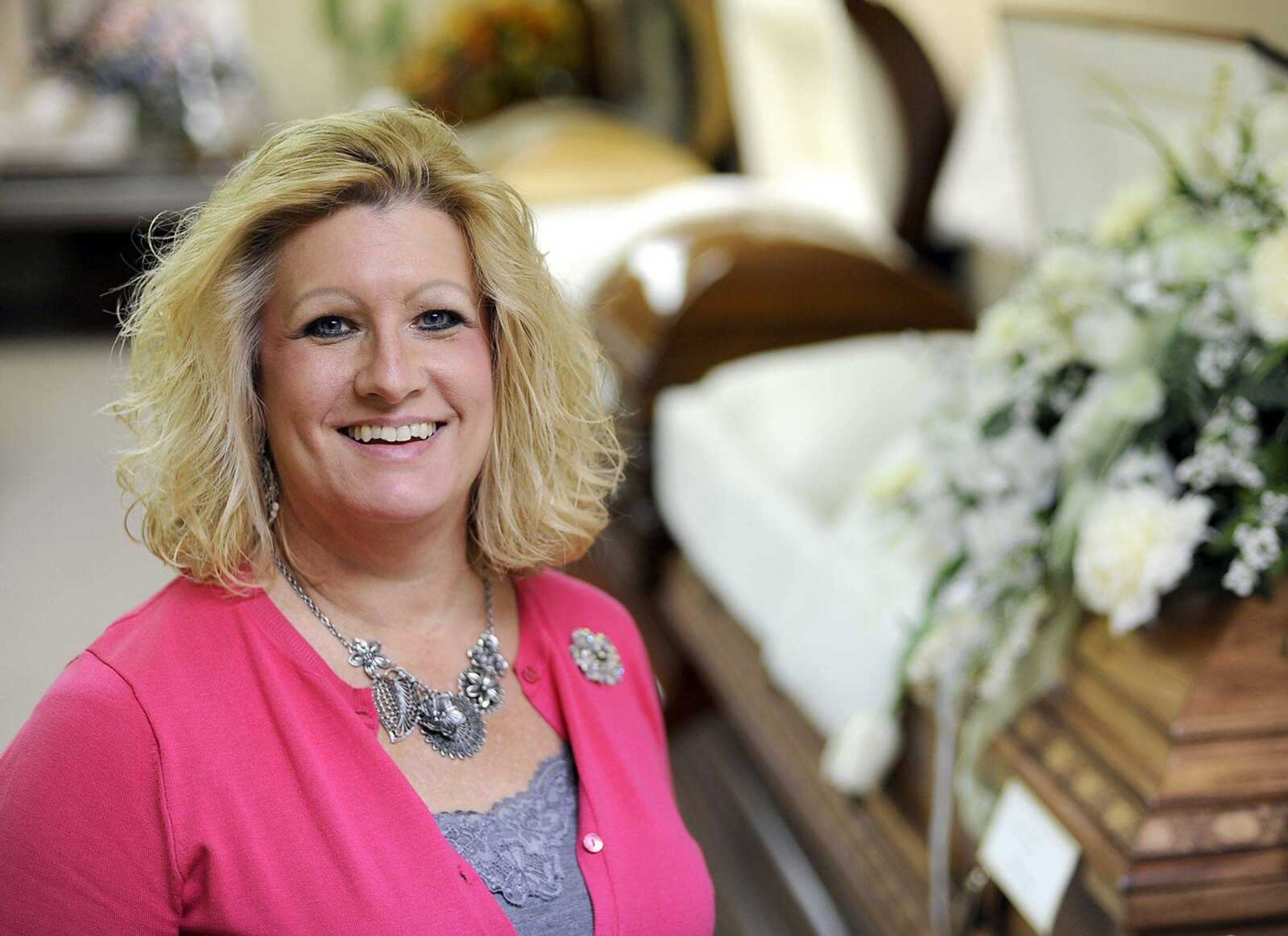 Cutline-File Credit:Christi Dockins Guilliams, a funeral director at McCombs Funeral Homes, poses for a photo Sept. 25 in Jackson. (Fred Lynch)