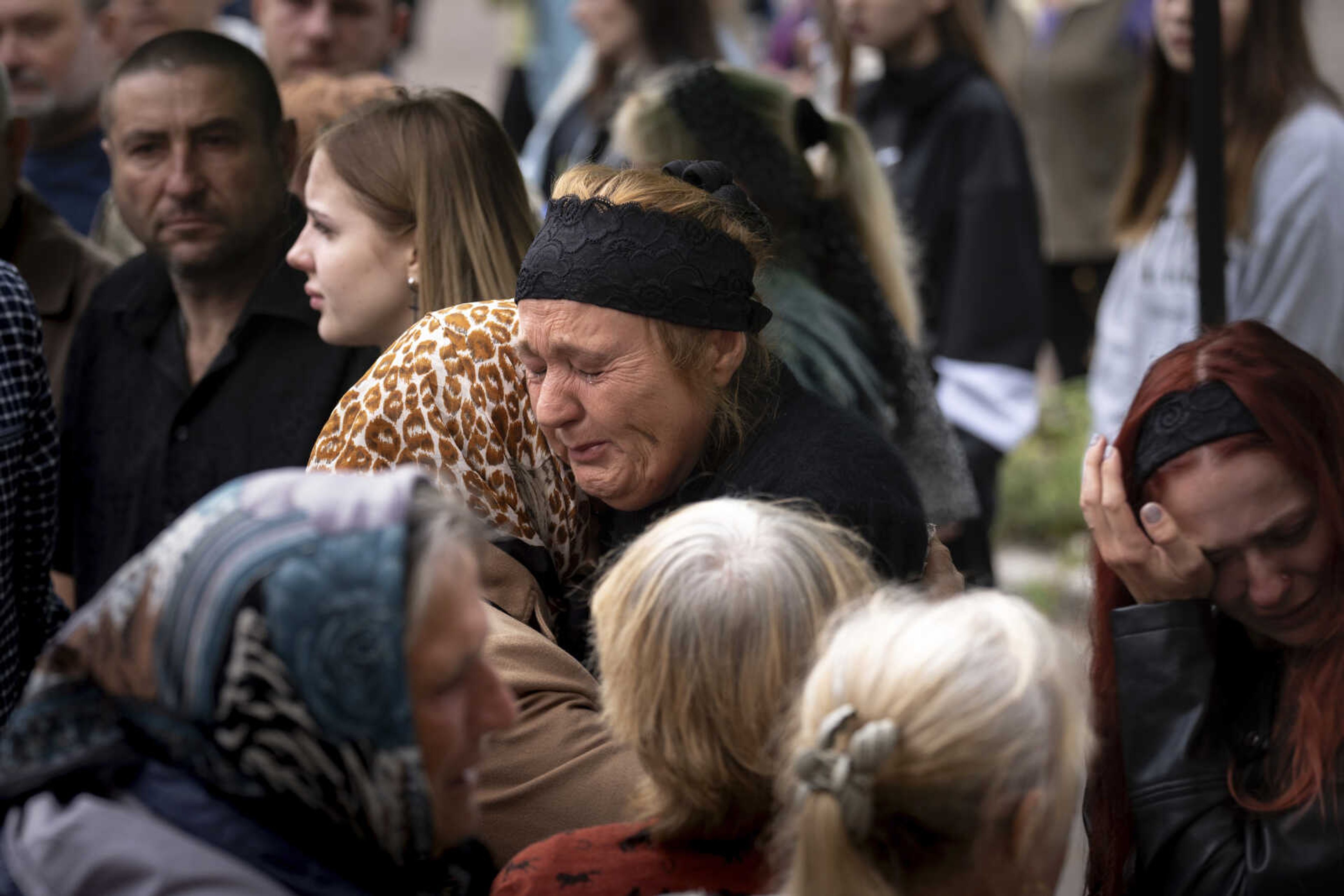 Svitlana Grinchenko, cries during a funeral ceremony for her son, Ukrainian soldier Andrii  Adam  Grinchenko of 3rd Assault Brigade, who was injured in the battle for Andriivka, in Shostka, Sumy region, Ukraine, Tuesday, Sept. 26, 2023.  He told me that  Mom, I was scared to sit in the basement from February 24 to 25 and look children and women in the eyes,  said Svitlana Grinchenko. (AP Photo/Roman Hrytsyna)