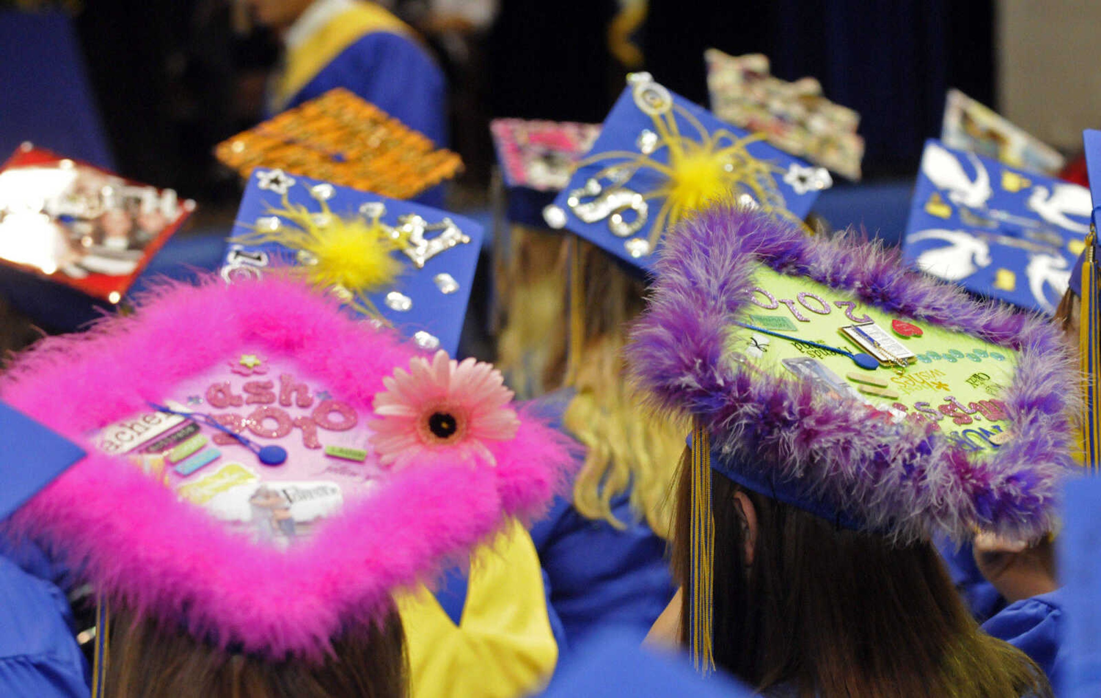 KRISTIN EBERTS ~ keberts@semissourian.com

Colorfully decorated caps dot the floor during Scott City High School's 2010 Commencement in the school gym on Sunday, May 23.