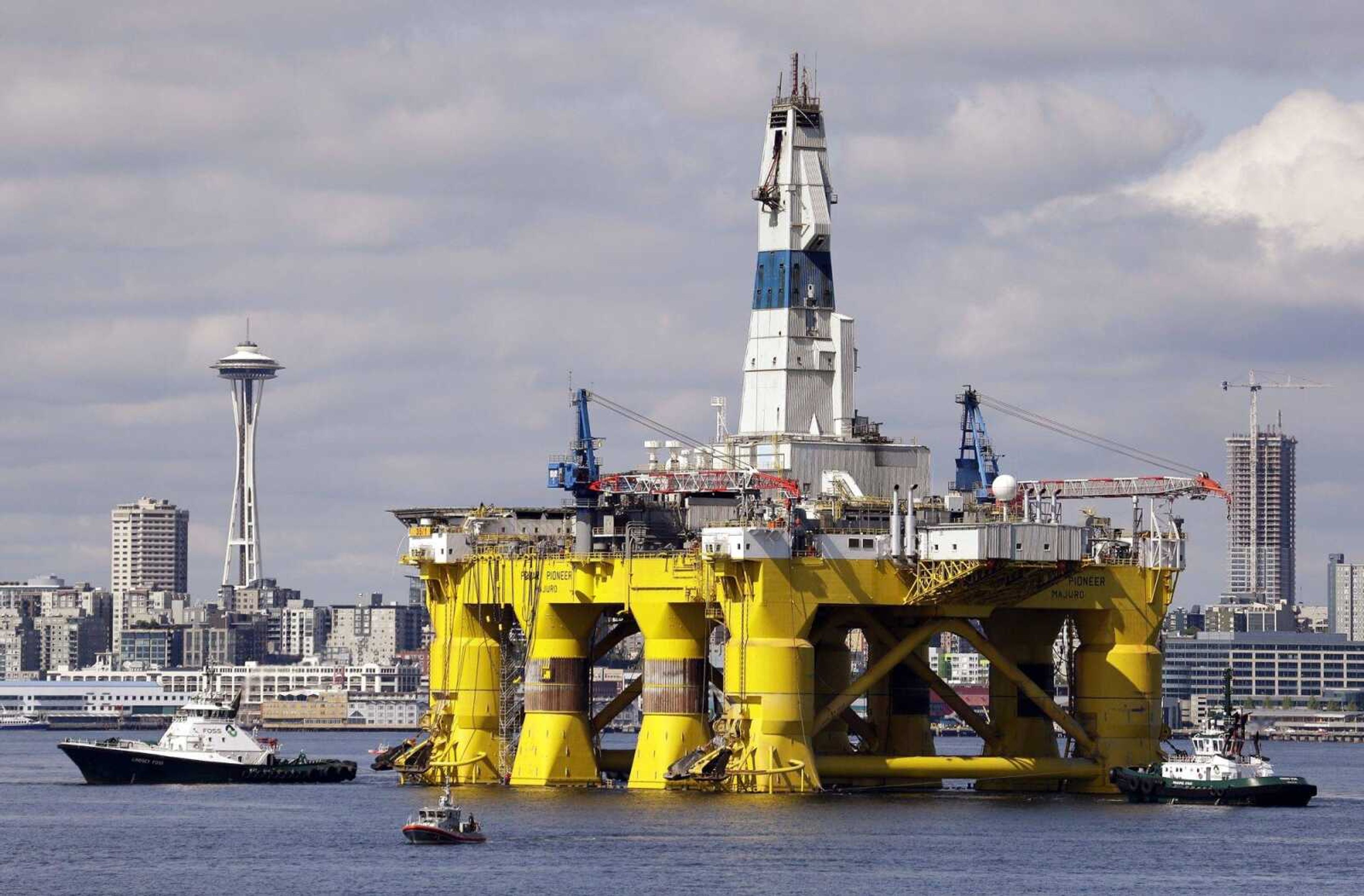 The oil drilling rig Polar Pioneer is towed toward a dock in Elliott Bay in Seattle. The rig was the first of two drilling rigs Royal Dutch Shell was outfitting for Arctic oil exploration.