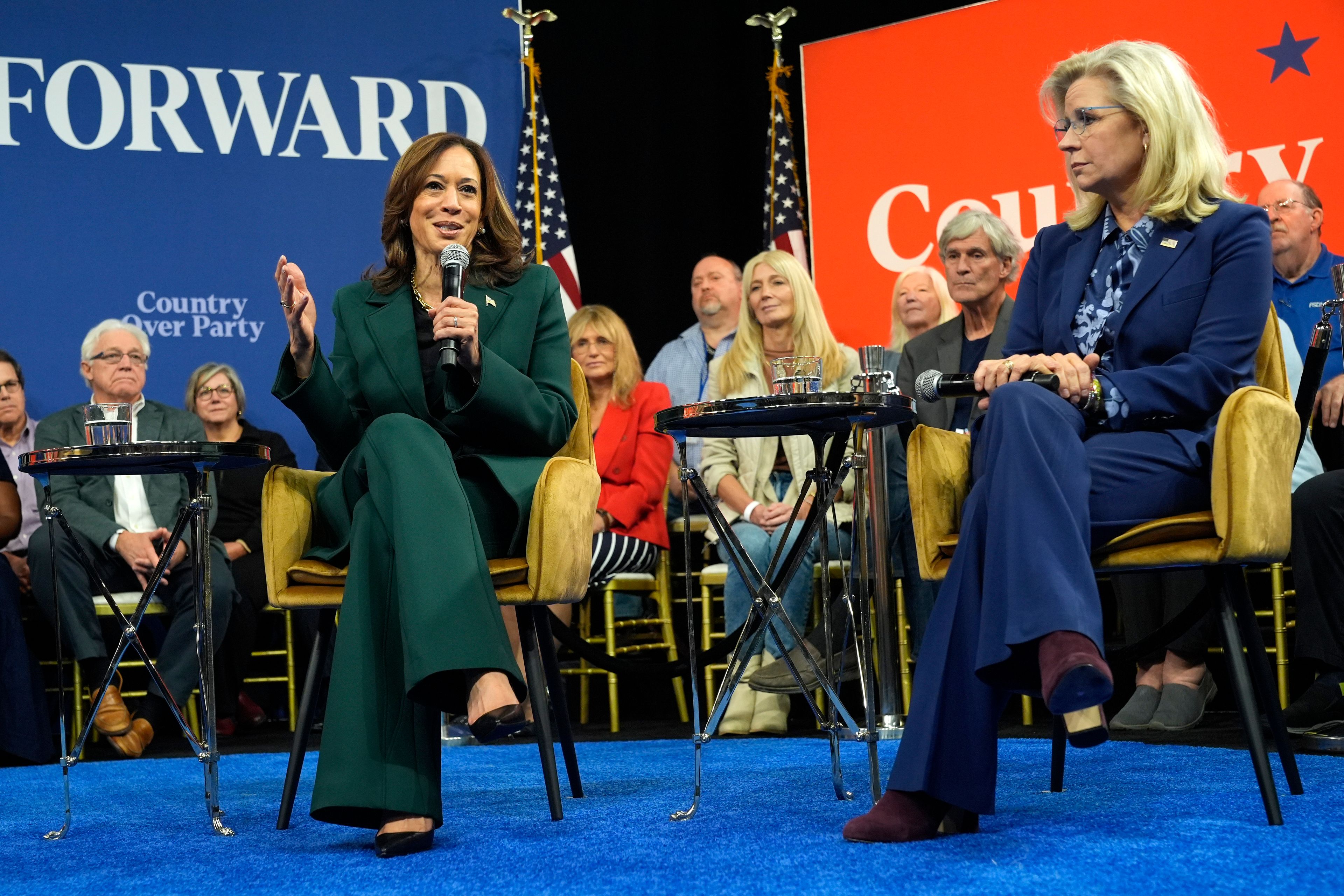 Democratic presidential nominee Vice President Kamala Harris speaks as former Republican Congresswoman Liz Cheney listens during a town hall at The People's Light in Malvern, Pa., Monday, Oct. 21, 2024. (AP Photo/Jacquelyn Martin)