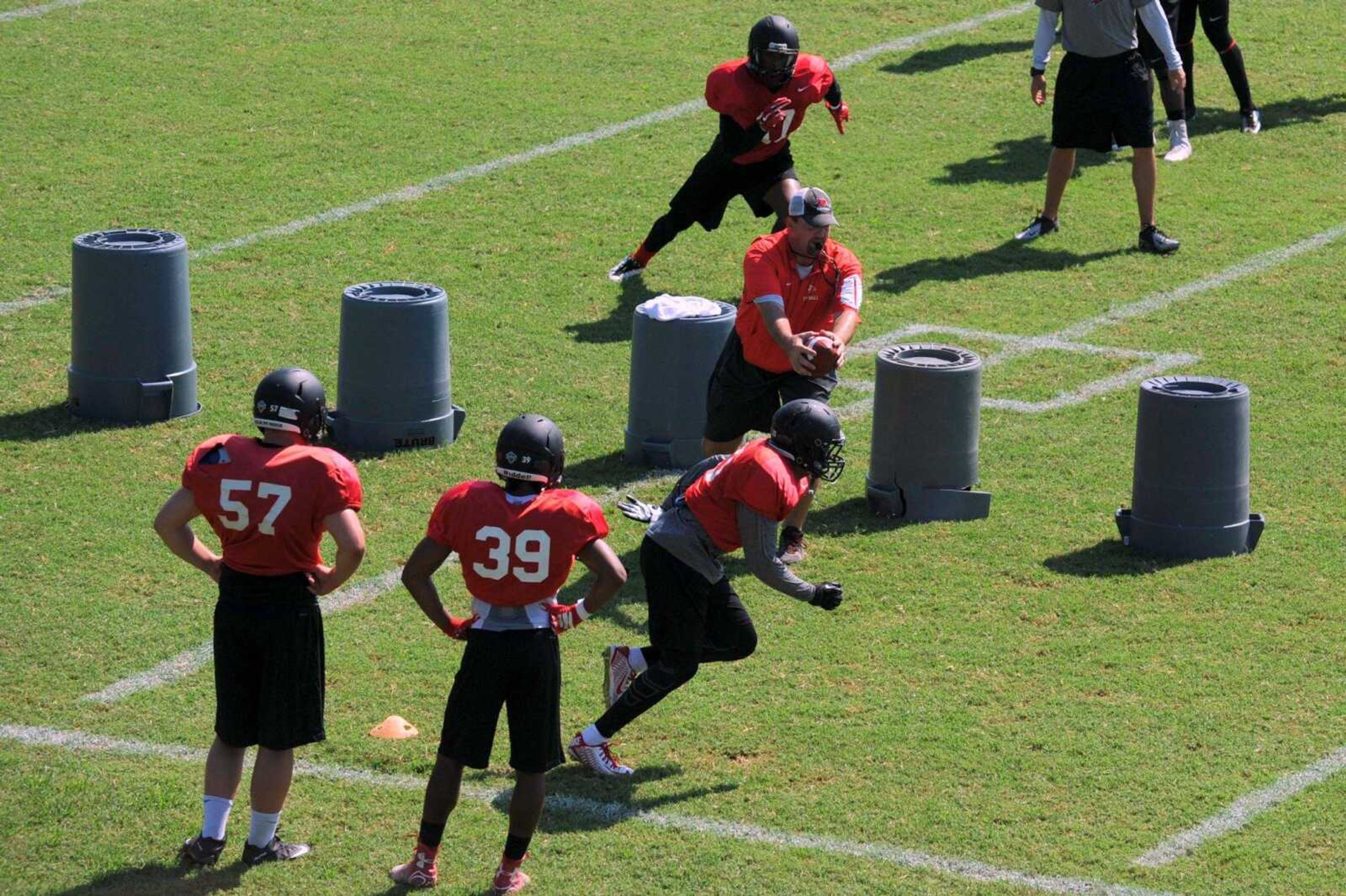 Southeast Missouri State coach Tom Matukewicz works with the defense during practice Wednesday, Aug. 10, 2016 at the Rosengarten Athletic Complex.
