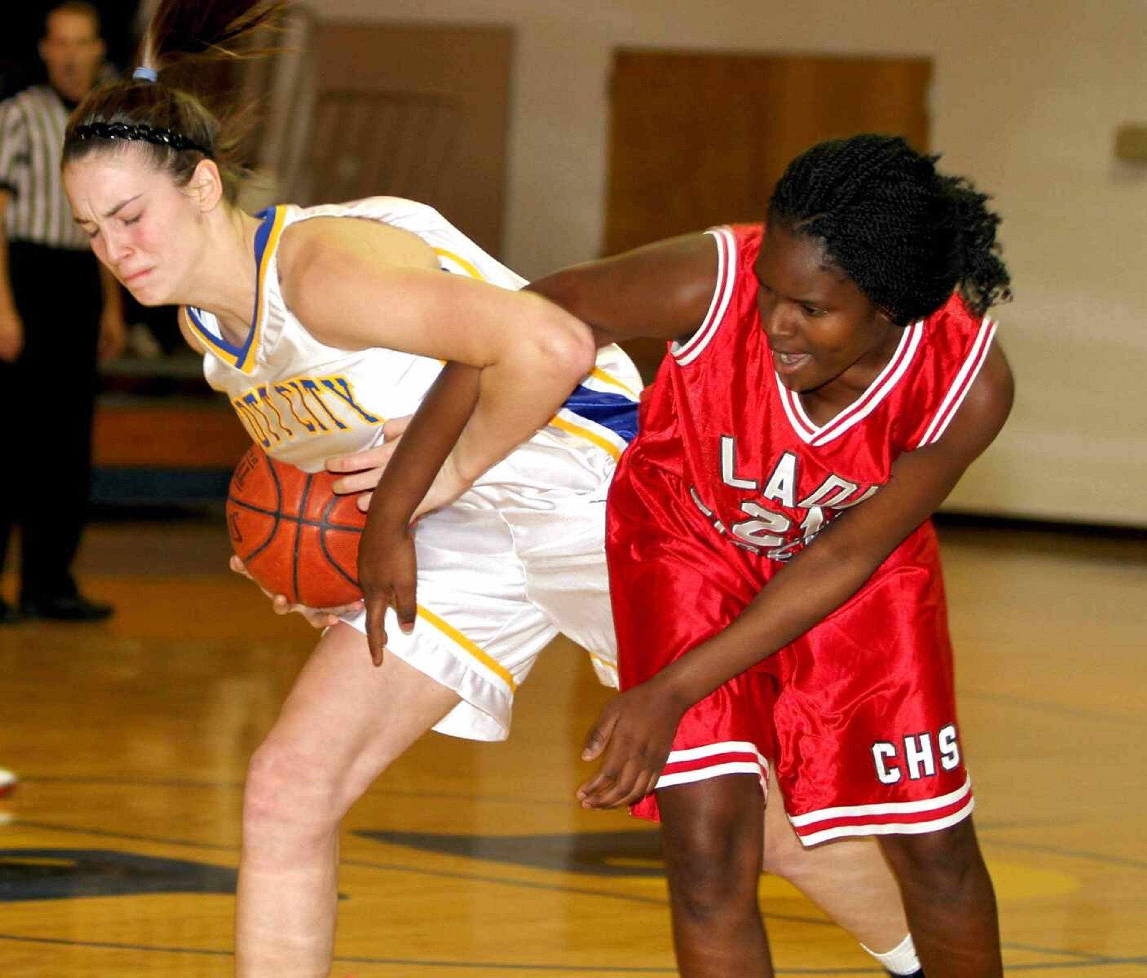 Scott City's Katie Hogan wrestles the ball away from Caruthersville's Vianna Carter during their game Wednesday. (DAVID JENKINS ~ Sikeston Standard-Democrat)