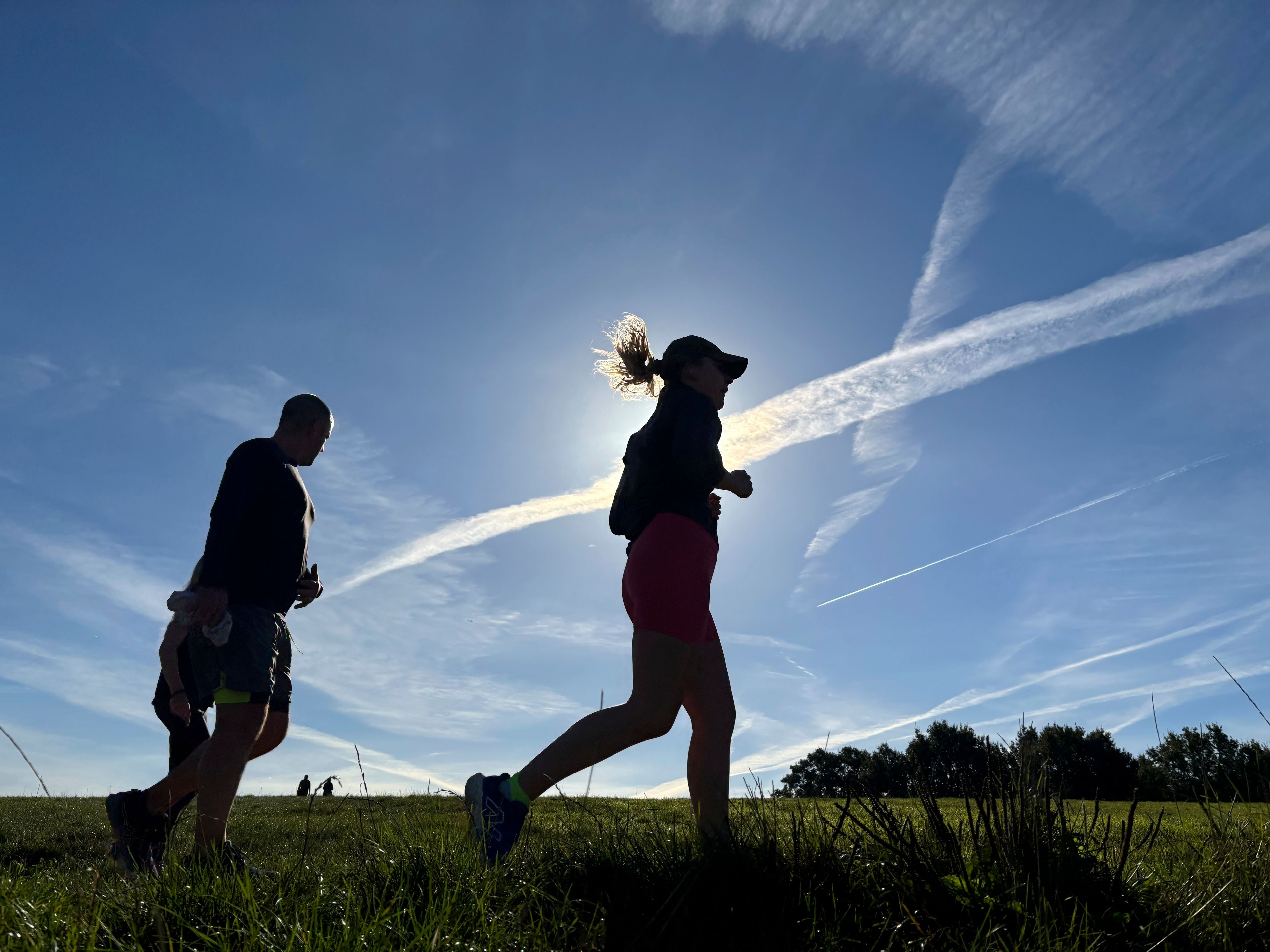 Runners cross Hampstead Heath in north London during a parkrun event on Saturday Sept. 14, 2024. (AP Photo/Lucy Nicholson)