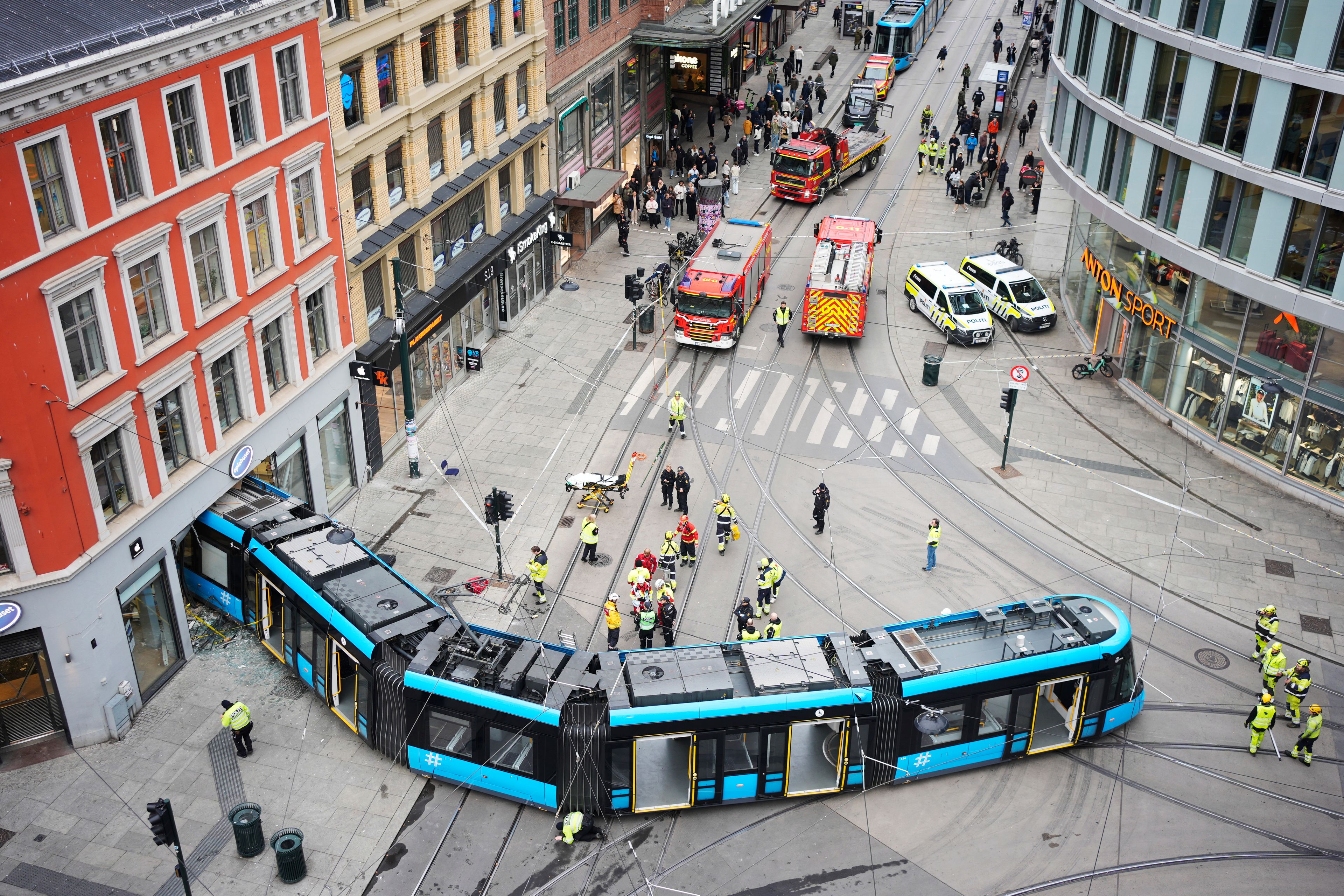 Emergency workers at the scene of a derailed tram that crashed into a building in downtown Oslo, Norway, Tuesday Oct. 29, 2024. (Terje Pedersen/NTB Scanpix via AP)