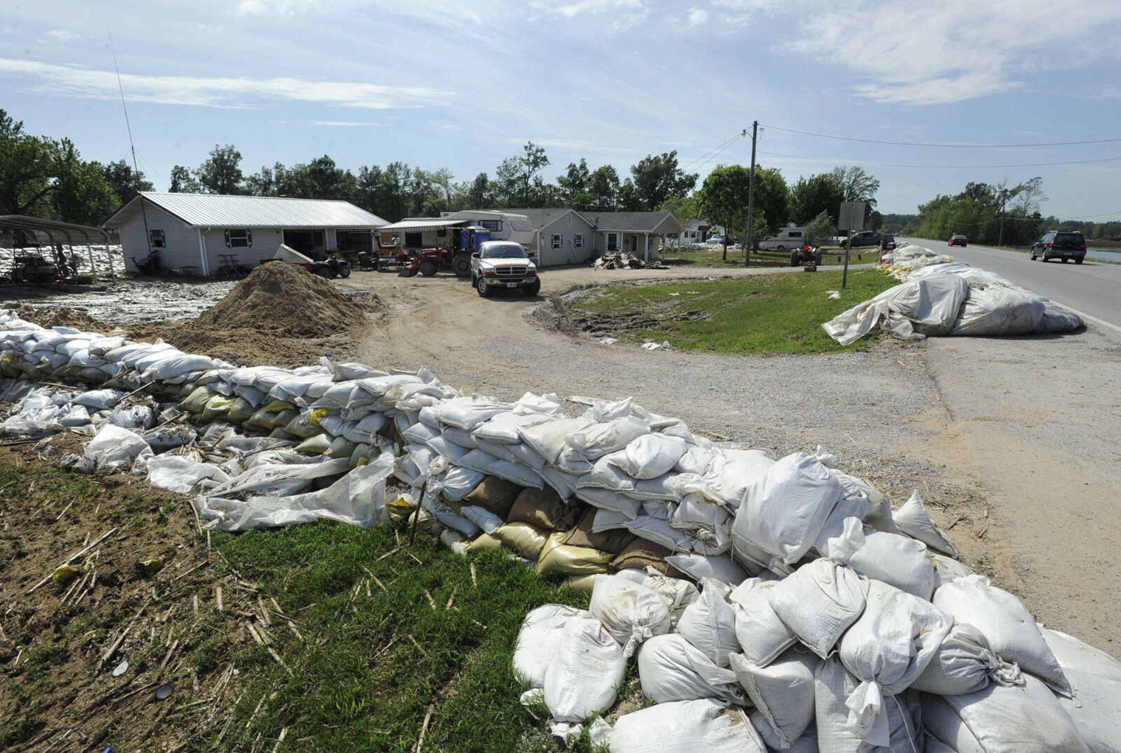 FRED LYNCH ~ flynch@semissourian.com
Sandbags remain Thursday, May 12, 2011 after floodwaters receded from homes along Illinois Highway 3 south of Olive Branch, Ill.