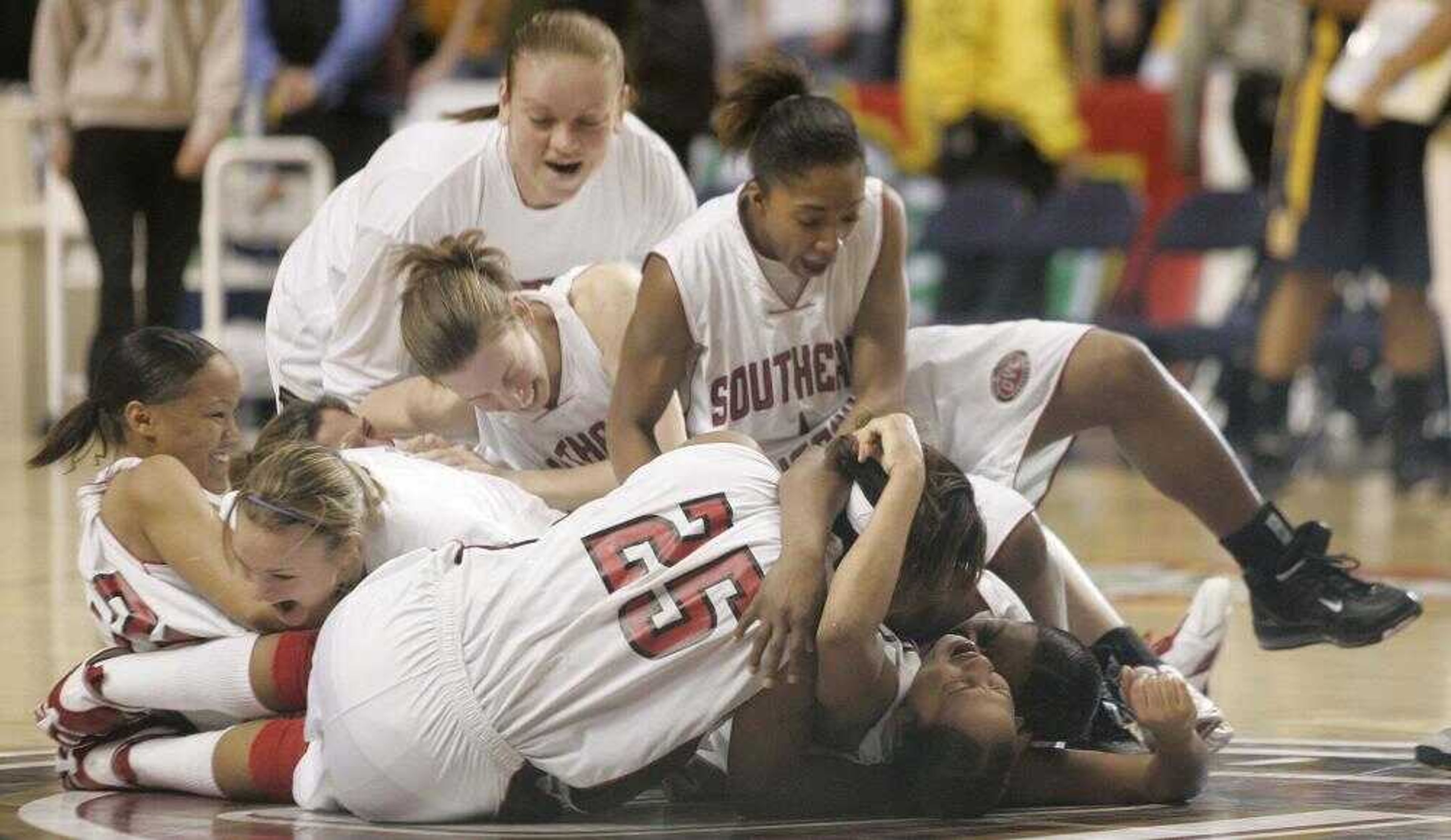 Members of the Southeast Missouri State women's basketball team celebrated Saturday after winning the Ohio Valley Championship game against Murray at the Gaylord Entertainment Center in Nashville, Tenn. Southeast scored a late basket for a 62-60 victory. (Robert Smith ~ Special to the Southeast Missourian)