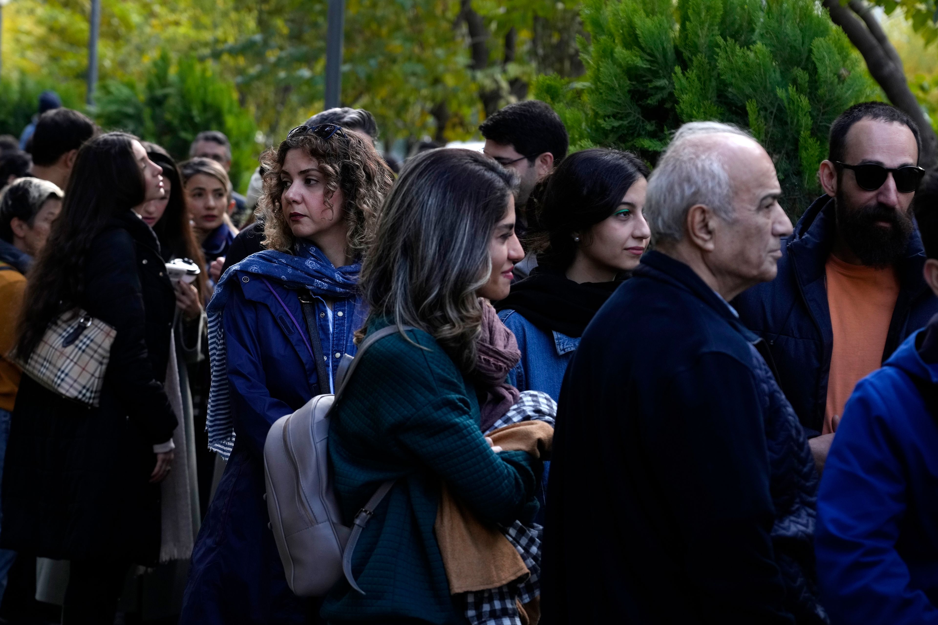 Iranians line up to visit an exhibition titled Eye to Eye which showcases over 120 works by modern world artists as well as Iranian painters at Tehran Museum of Contemporary Art, in Tehran, Thursday, Nov. 21, 2024. (AP Photo/Vahid Salemi)