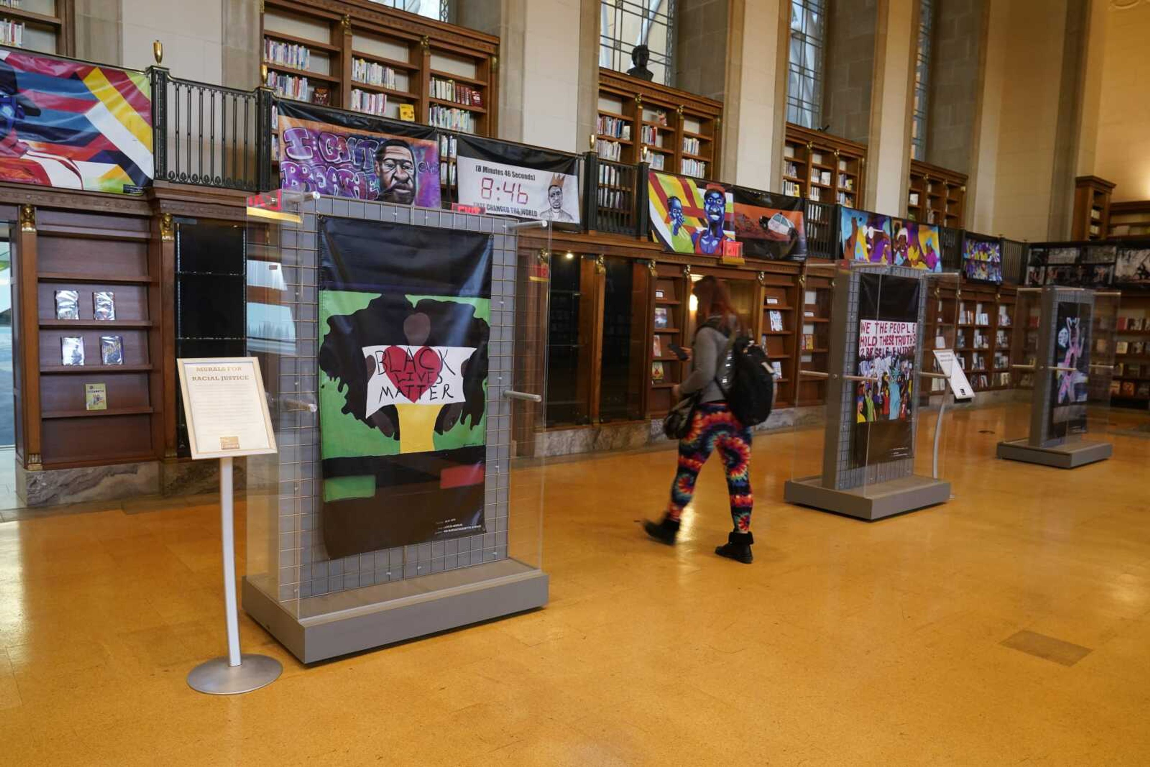 Vinyl banners representing the 24 murals that were painted in the downtown area of Indianapolis are displayed Thursday at the Central Library.