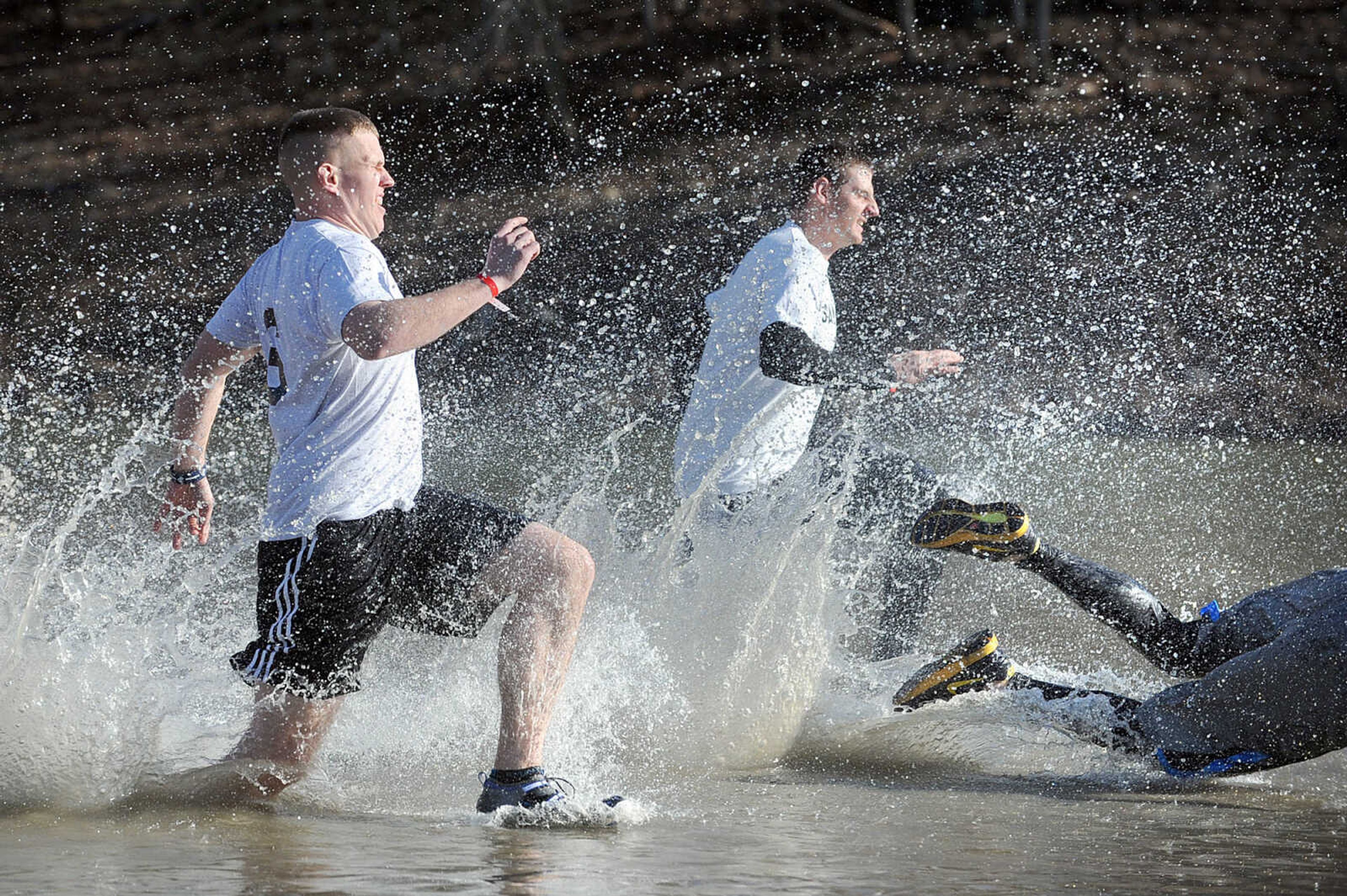 LAURA SIMON ~ lsimon@semissourian.com
People plunge into the cold waters of Lake Boutin Saturday afternoon, Feb. 2, 2013 during the Polar Plunge at Trail of Tears State Park. Thirty-six teams totaling 291 people took the annual plunge that benefits Special Olympics Missouri.