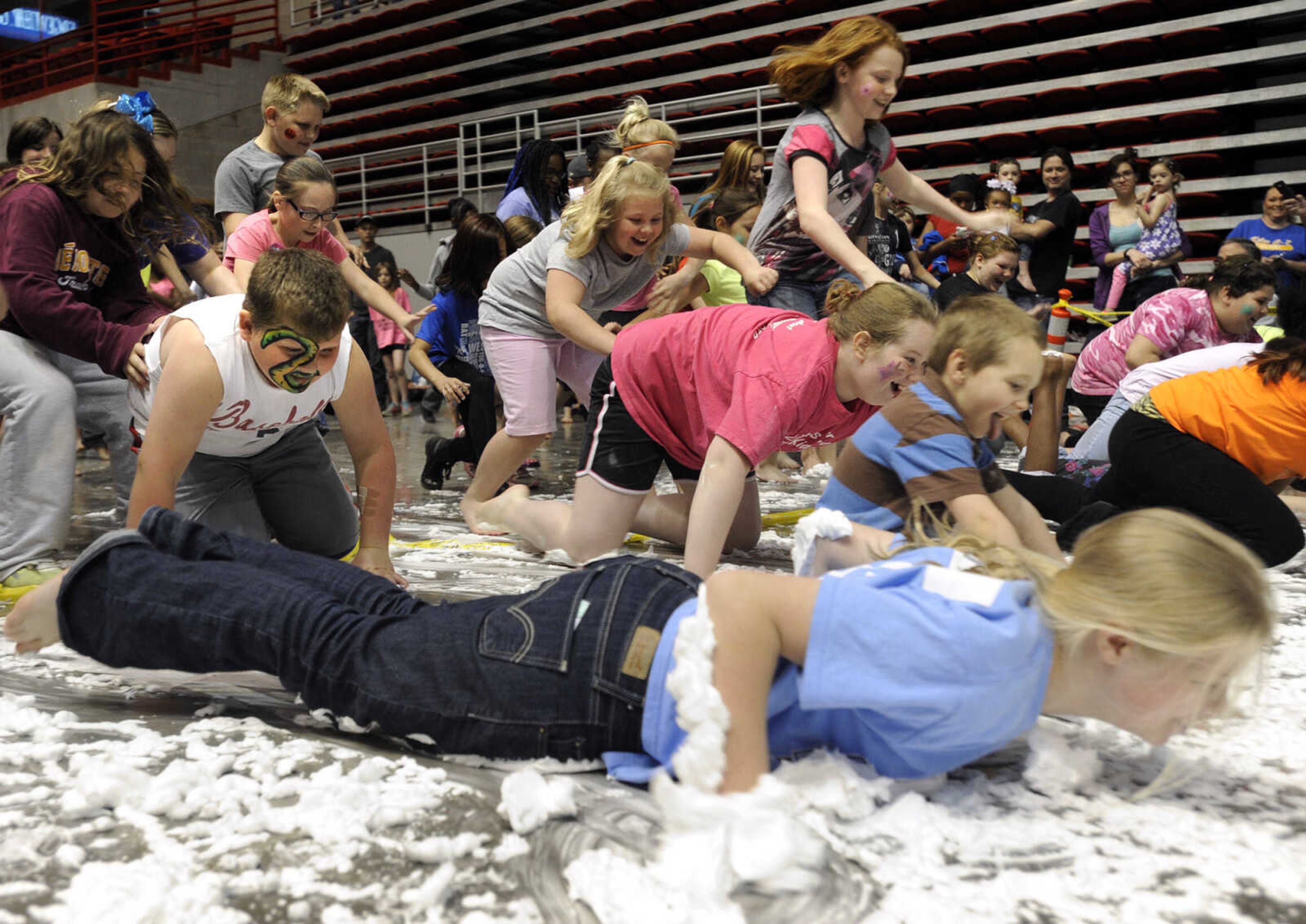 Youngsters begin the Shaving Cream Crawl at the Messy Morning event Saturday, April 25, 2015 at the Show Me Center.