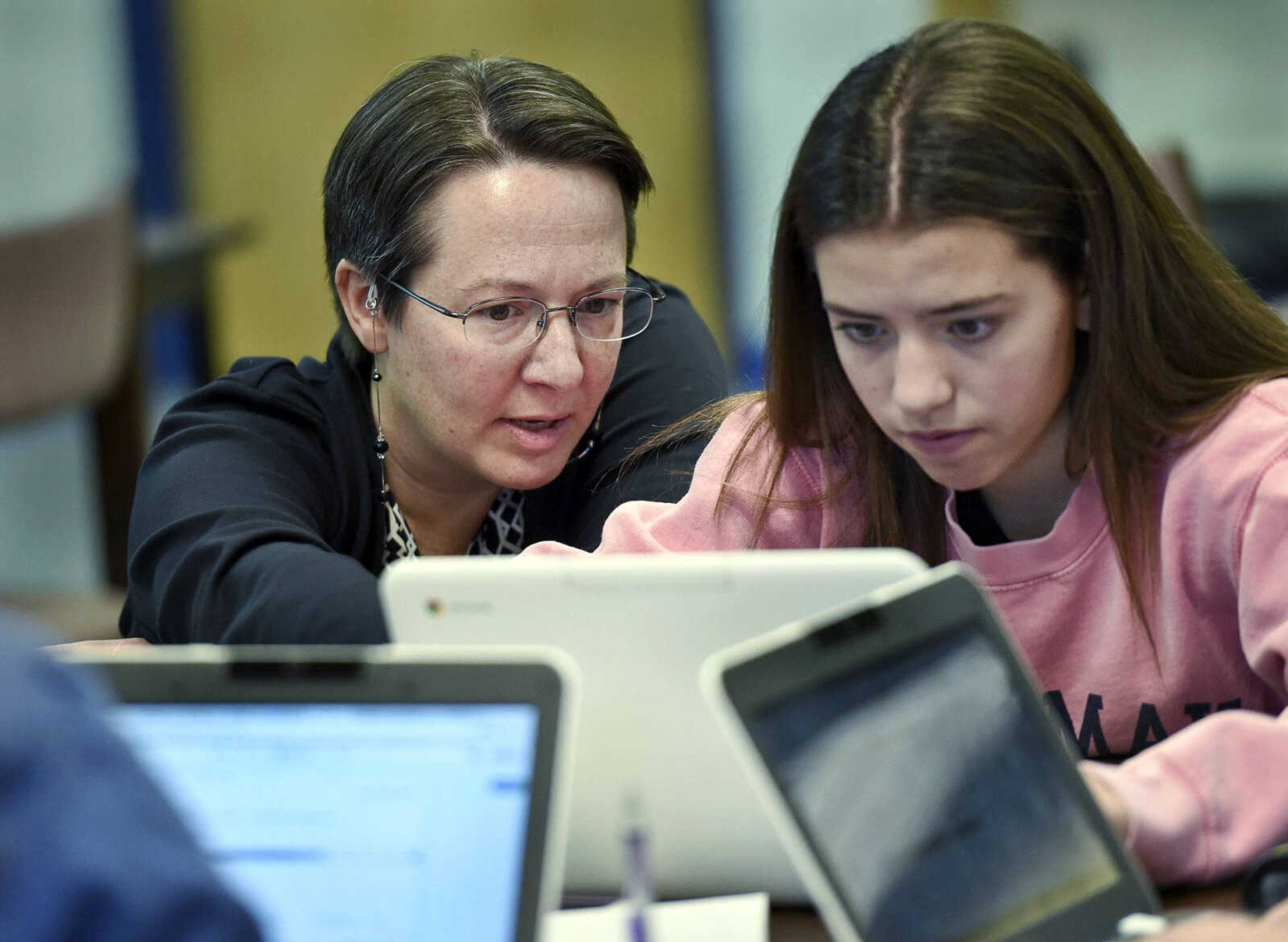 Jennifer Rocca, left, a teacher-librarian at Brookfield, Connecticut, High School, works with Ariana Mamudi, 14, a freshman in her Digital Student class.<br>The required class teaches media-literacy skills and has the students scrutinize sources for their on-line information.