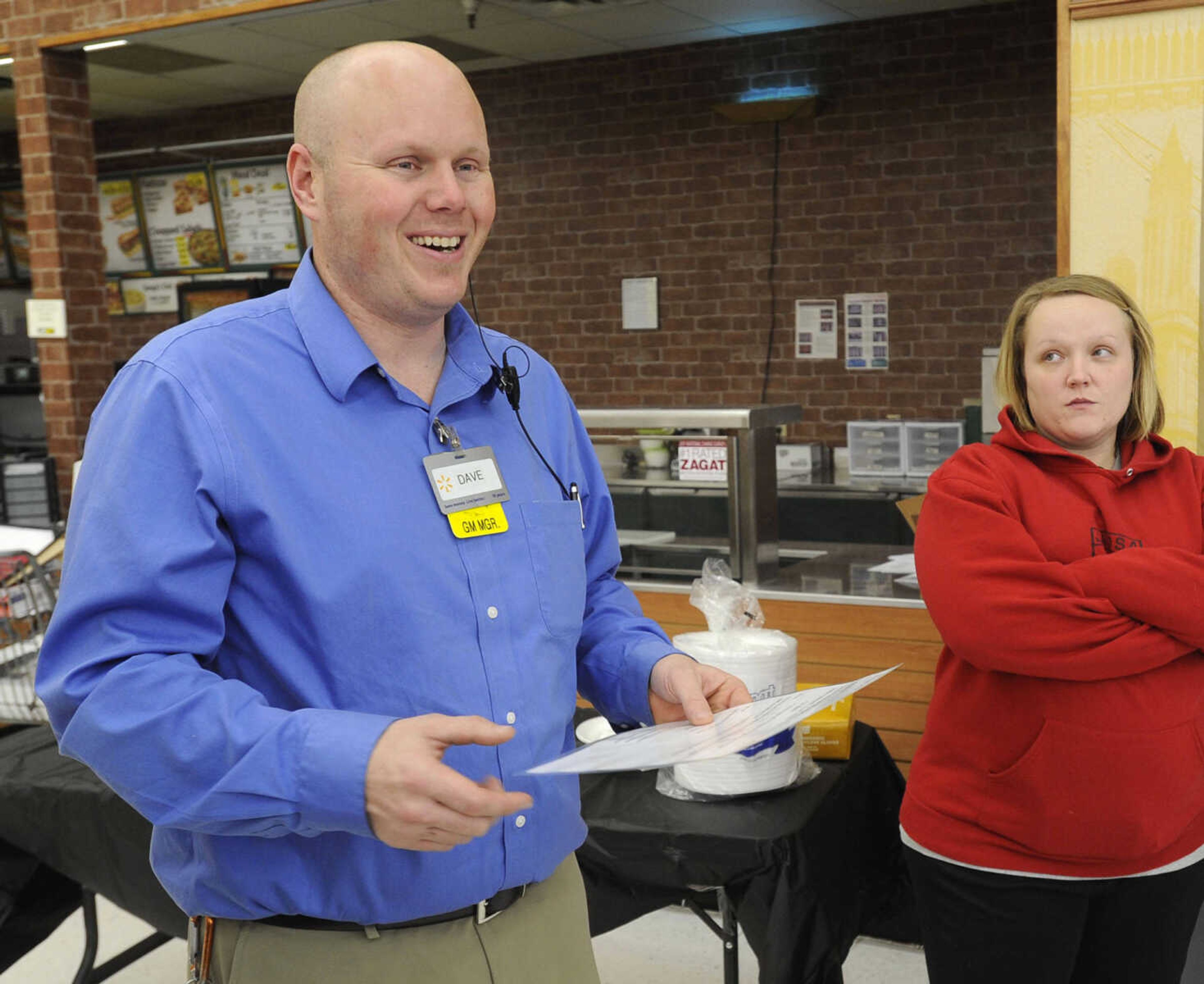 Dave Avery, Walmart shift manager, conducts the prize drawing at the "Gone Girl" DVD release party Monday, Jan. 12, 2015 at Walmart in Cape Girardeau.