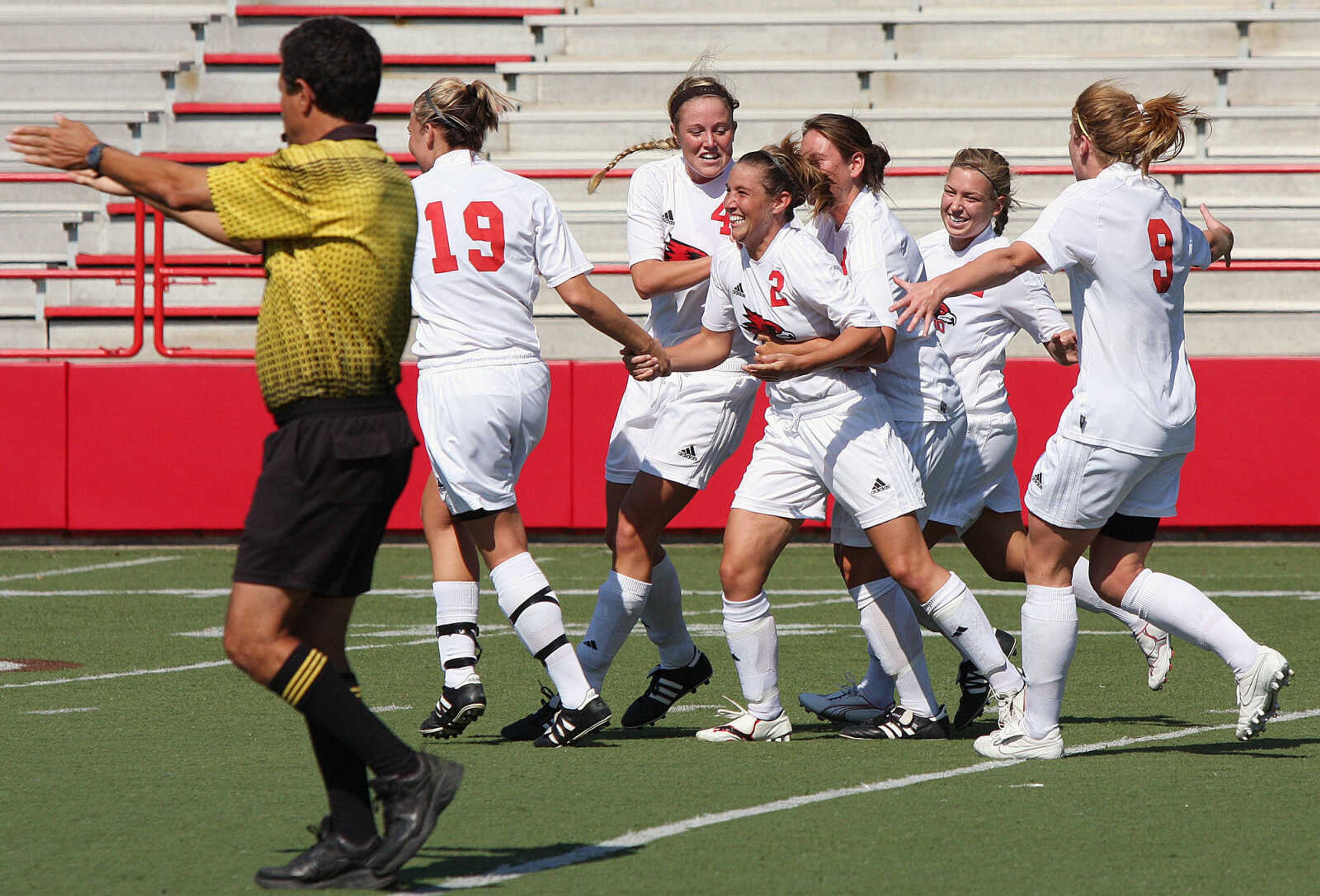 The Redhawks celebrate Stephanie Kulavic's (#2) first half goal.