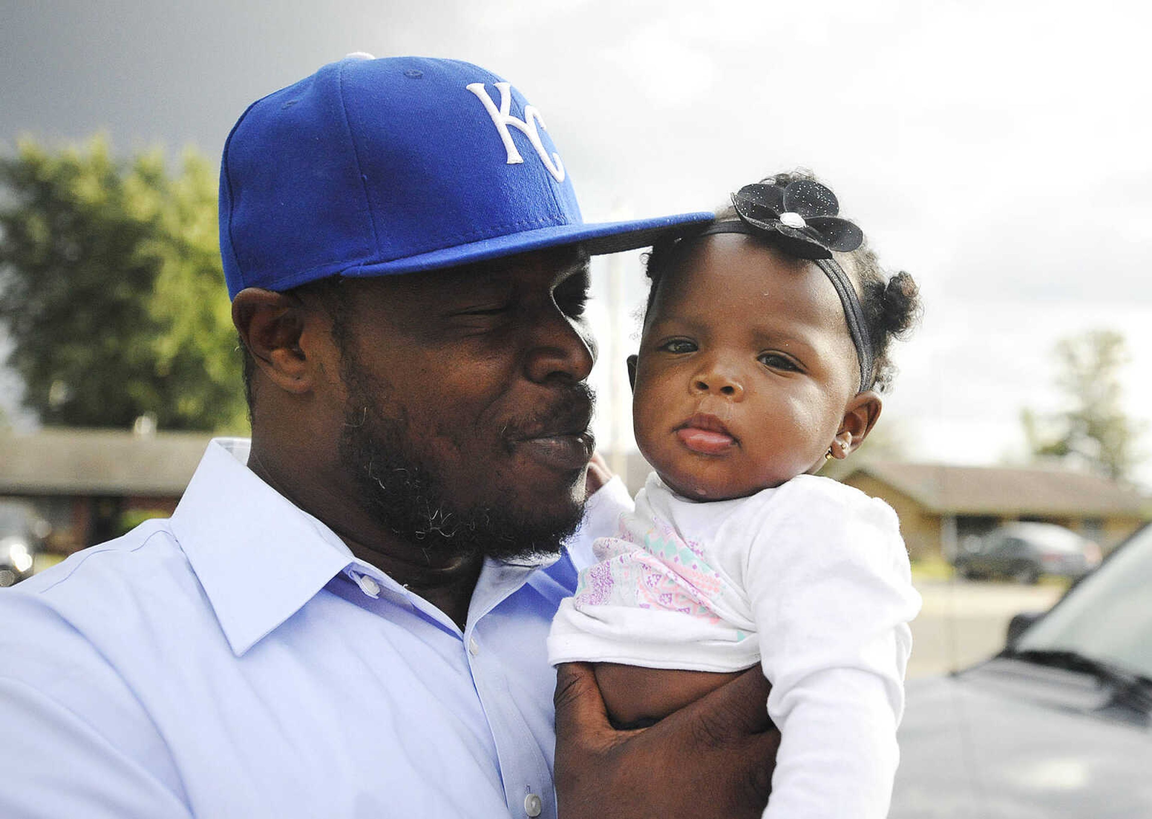 LAURA SIMON ~ lsimon@semissourian.com

Justin Robinson holds then seventh-month-old Justice, outside his mother's Sikeston, Missouri home in September.