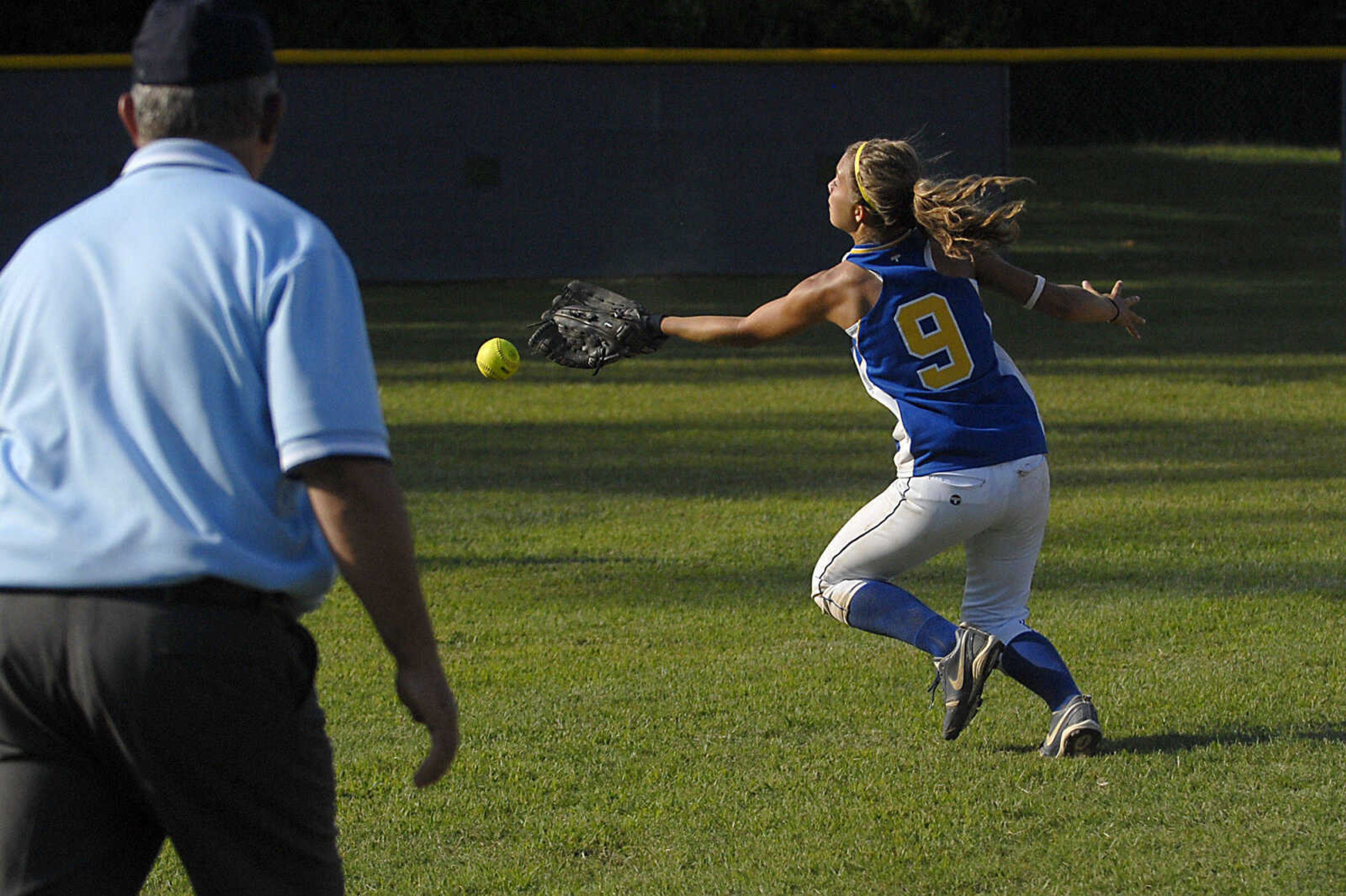 KIT DOYLE ~ kdoyle@semissourian.com
St. Vincent shortstop Kayla Seabaugh cannot catch up to a shallow pop fly to left field Tuesday afternoon, August 25, 2009, in Oran.  Oran scored the game-ending 13th run on the play.