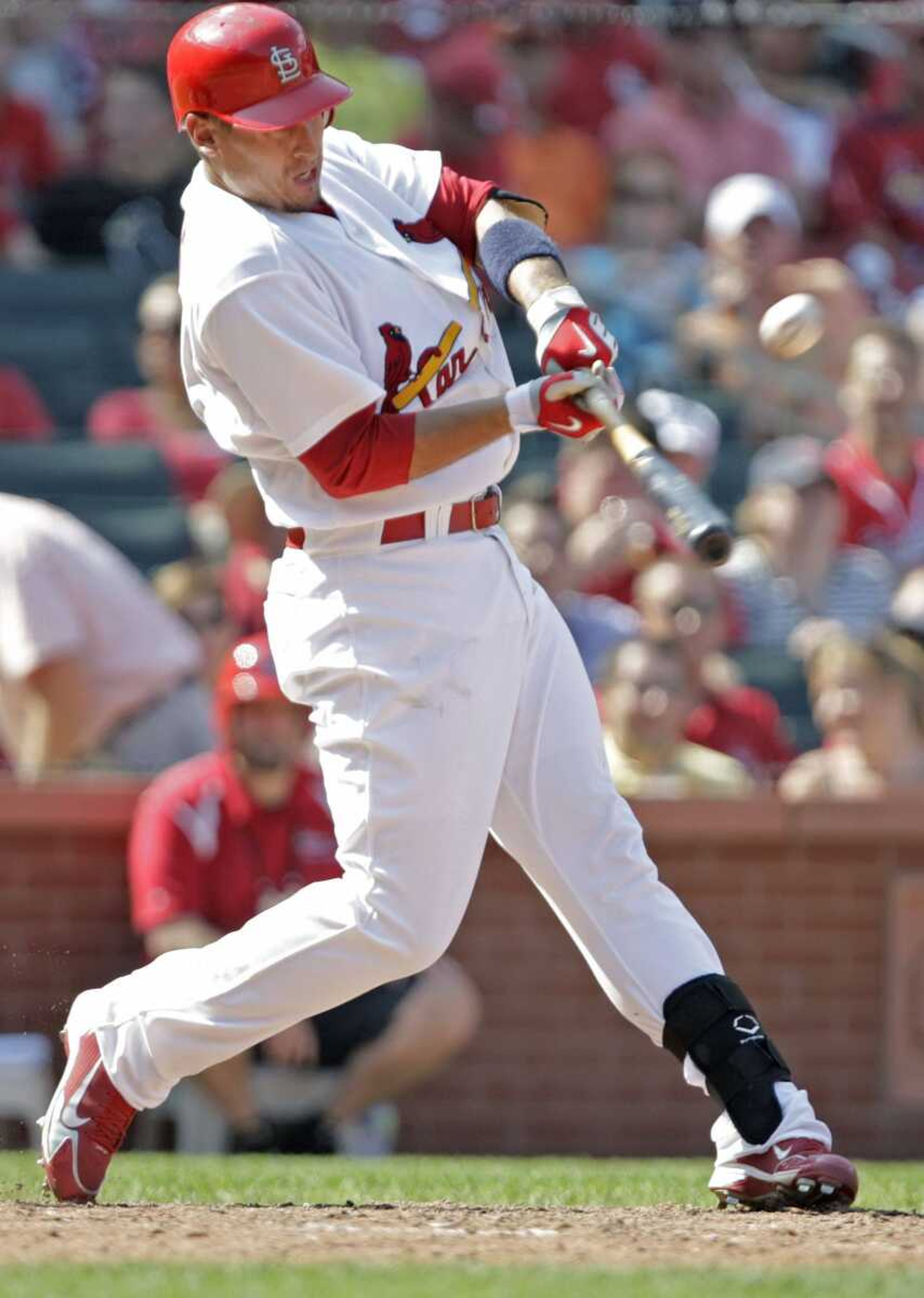 The Cardinals' Allen Craig connects for an RBI single during the eighth inning Sunday against the Giants in St. Louis. Craig had two hits, including a two-run home run. (Tom Gannam ~ Associated Press)