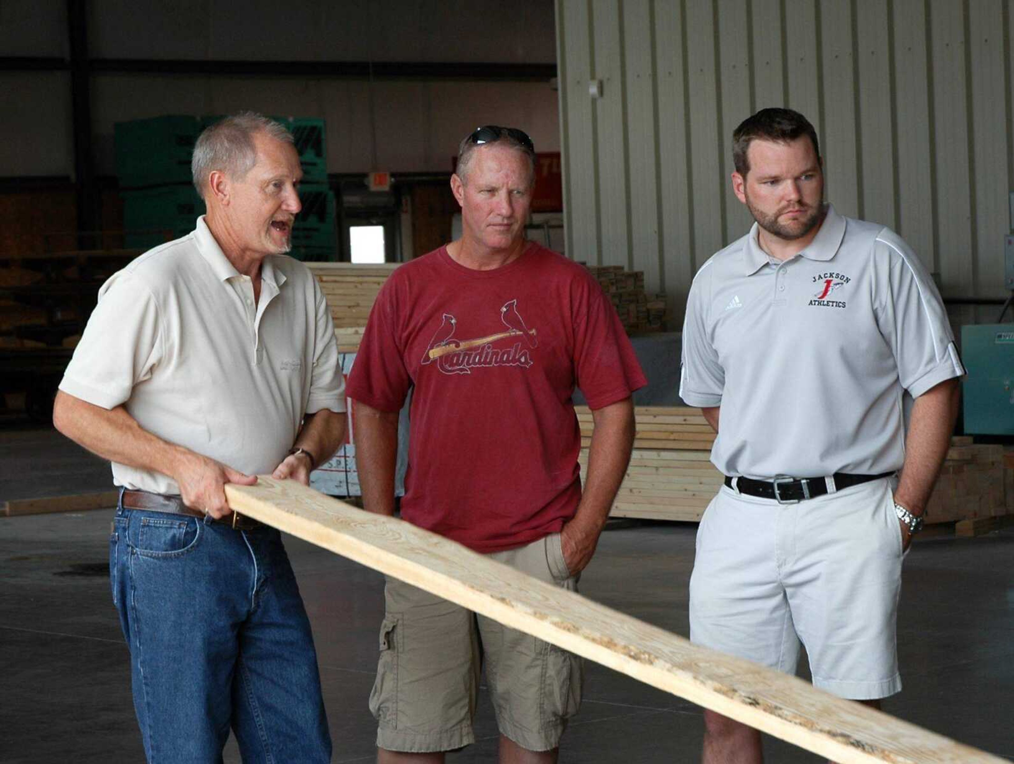 Dale Schemel, left, president of BBL Buildings &amp; Components, Ltd., near Biehle, Mo., explains how the lumber used in his plant is tested for strength during the Jackson Chamber of Commerce&#180;s annual Ag Tour on Wednesday, July 21. (MELISSA MILLER)