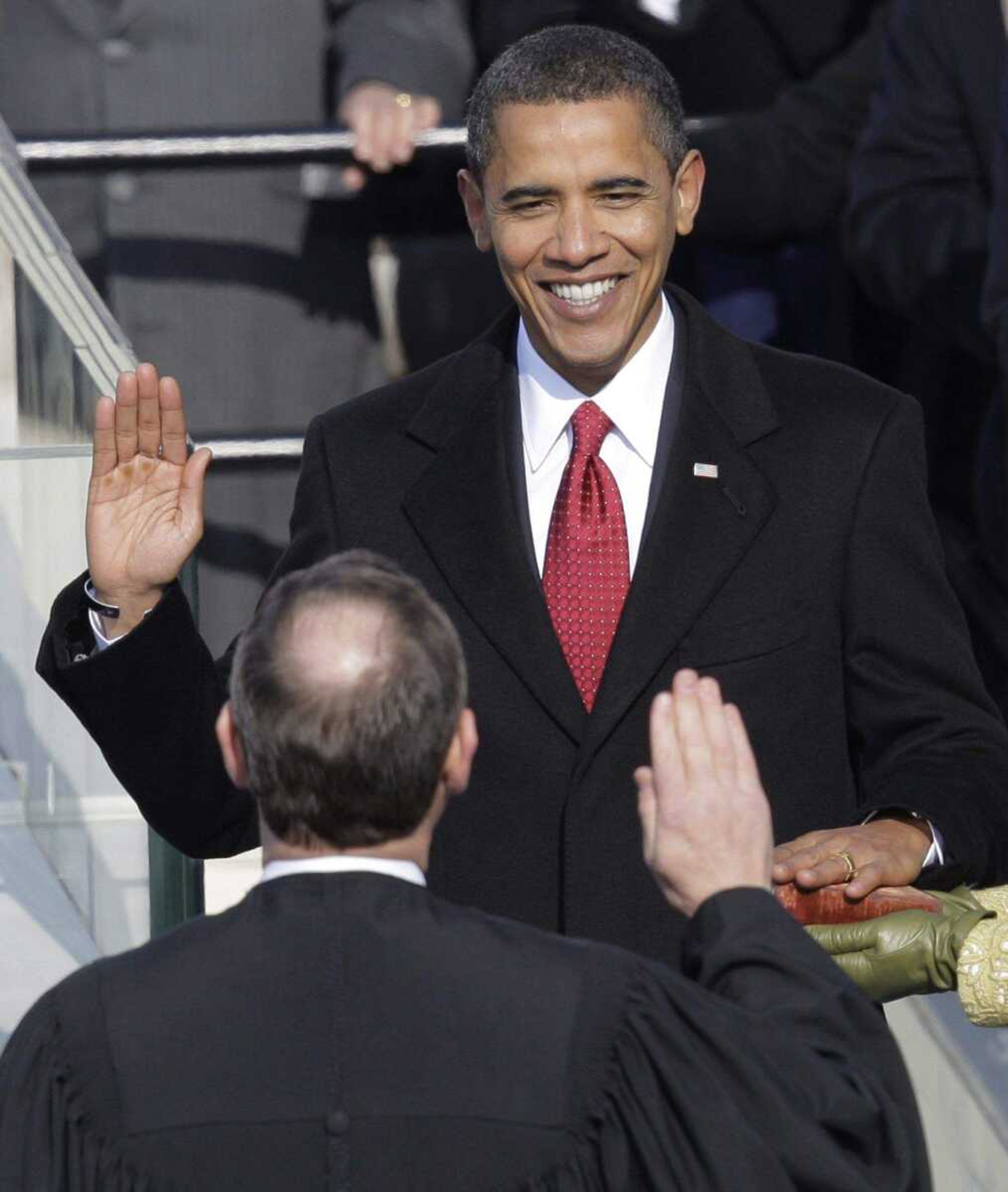 Barack Obama, left, takes the oath of office from Chief Justice John Roberts to become the 44th president of the United States at the U.S. Capitol in Washington, Tuesday, Jan. 20, 2009. (AP Photo/Jae C. Hong)