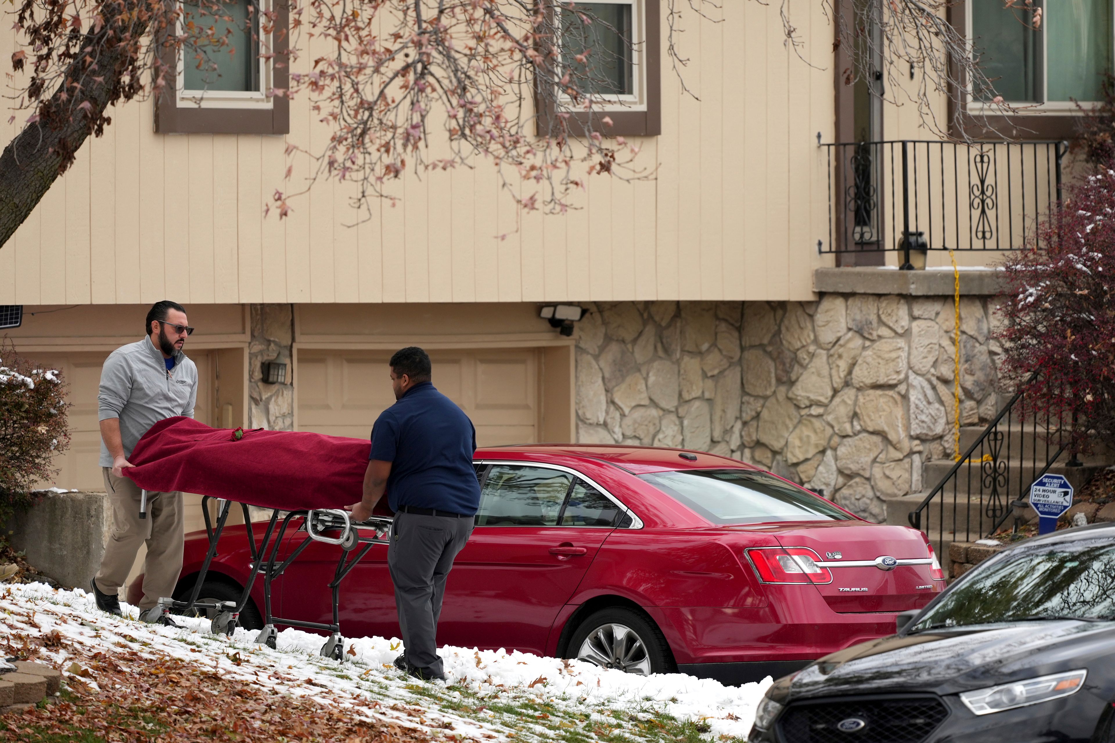 Workers carry a body from the home of former Kansas City, Kan. police detective Roger Golubski on Monday, Dec. 2, 2024, in Edwardsville, Kan. (AP Photo/Charlie Riedel)