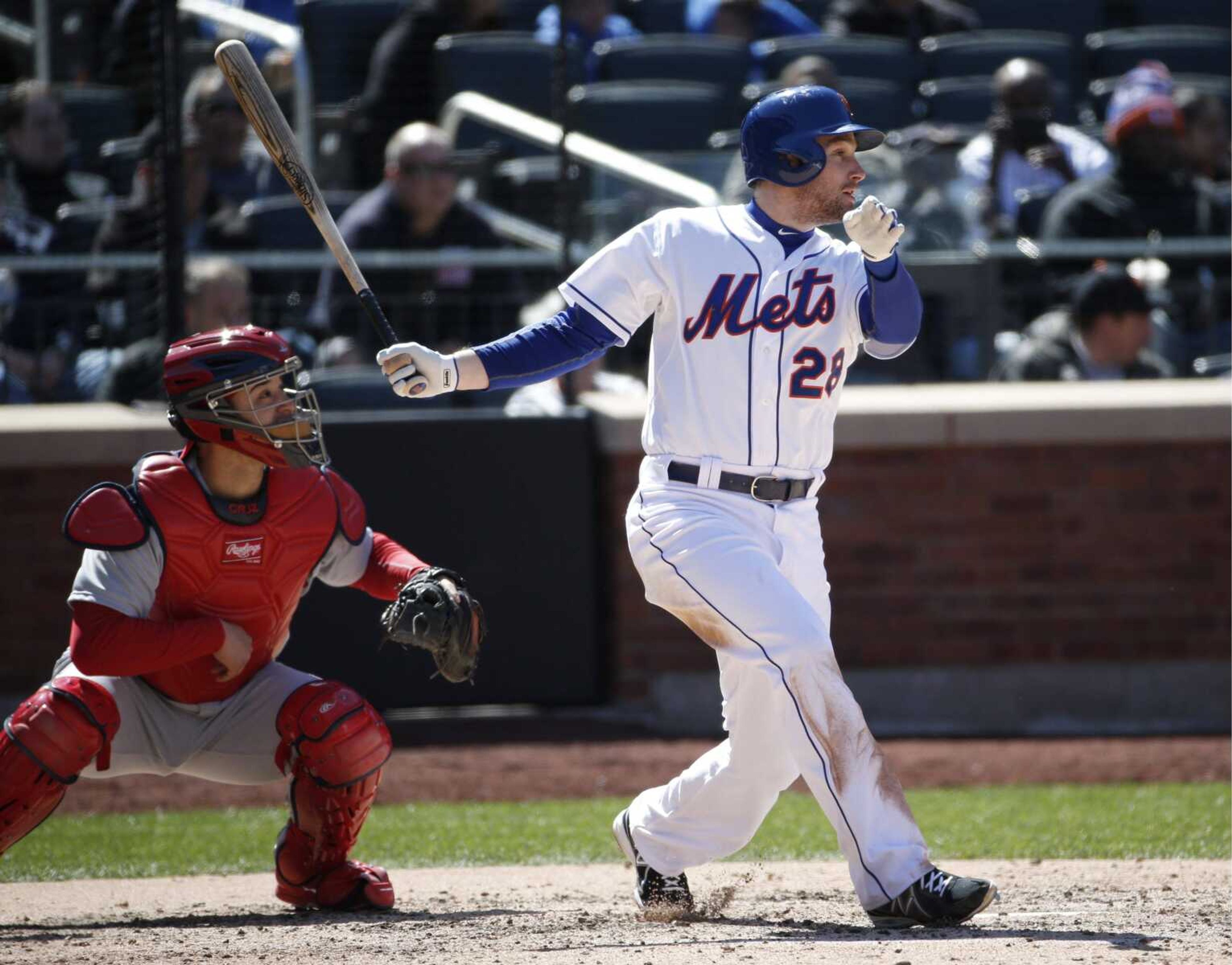 The Mets&#8217; Daniel Murphy watches his RBI double along with Cardinals catcher Tony Cruz during the sixth inning Thursday in New York. (Kathy Willens ~ Associated Press)