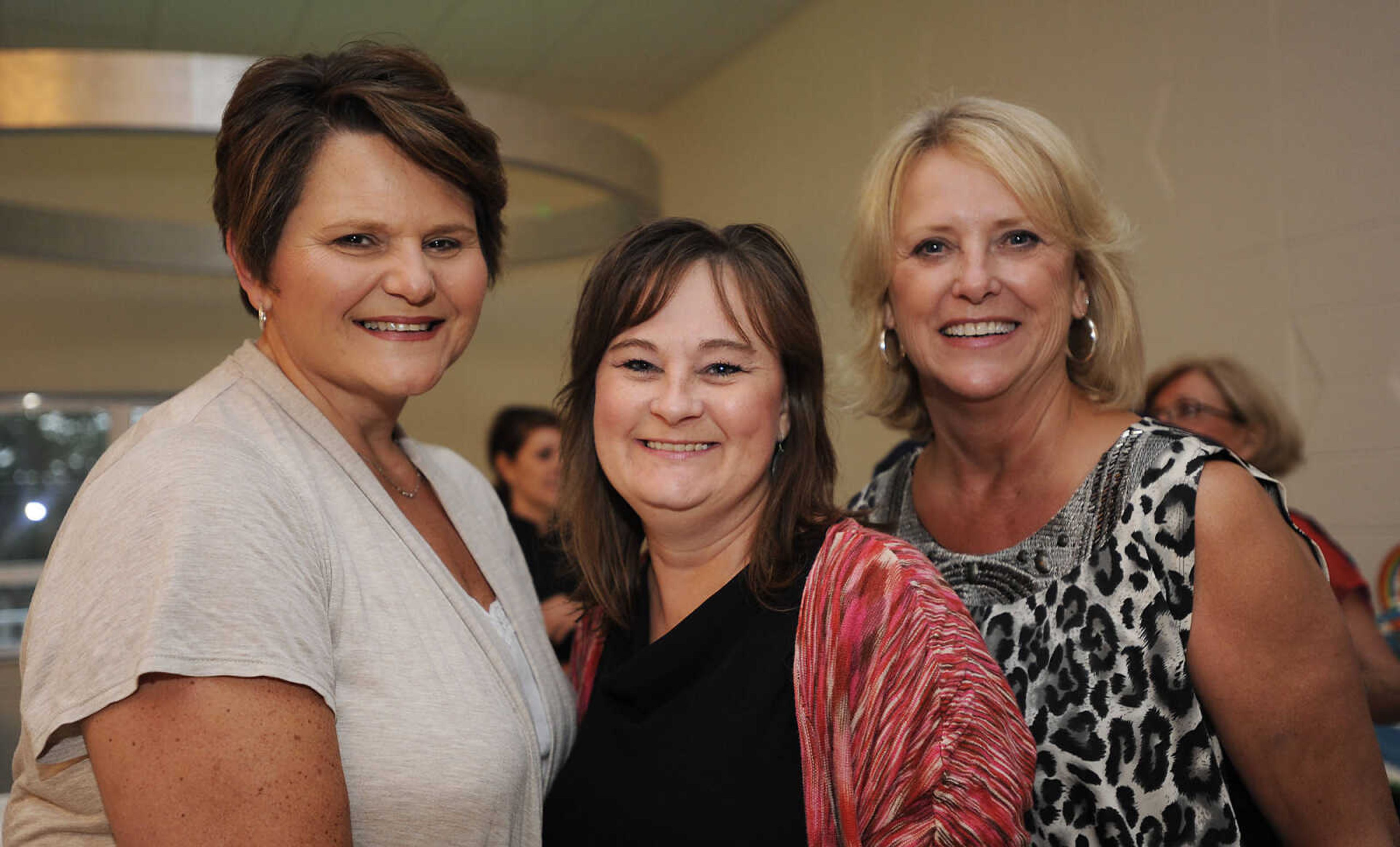 Debbie Simmons, elft, Tracey Glenn and Pansy Glenn at The Summer Cocktail Soiree Friday, Aug. 3, at the Concourse, 429 N. Broadview St. in Cape Girardeau. A fundraiser for Levi's Adventure Trail, an exhibit at the Discovery Playhouse in Cape Girardeau, the event featured live music, a silent auction and gourmet appetizers. The exhibit is named after Levi Stephen Collom, who died at age 3 earlier this year. Mosley is Levi's grandfather.