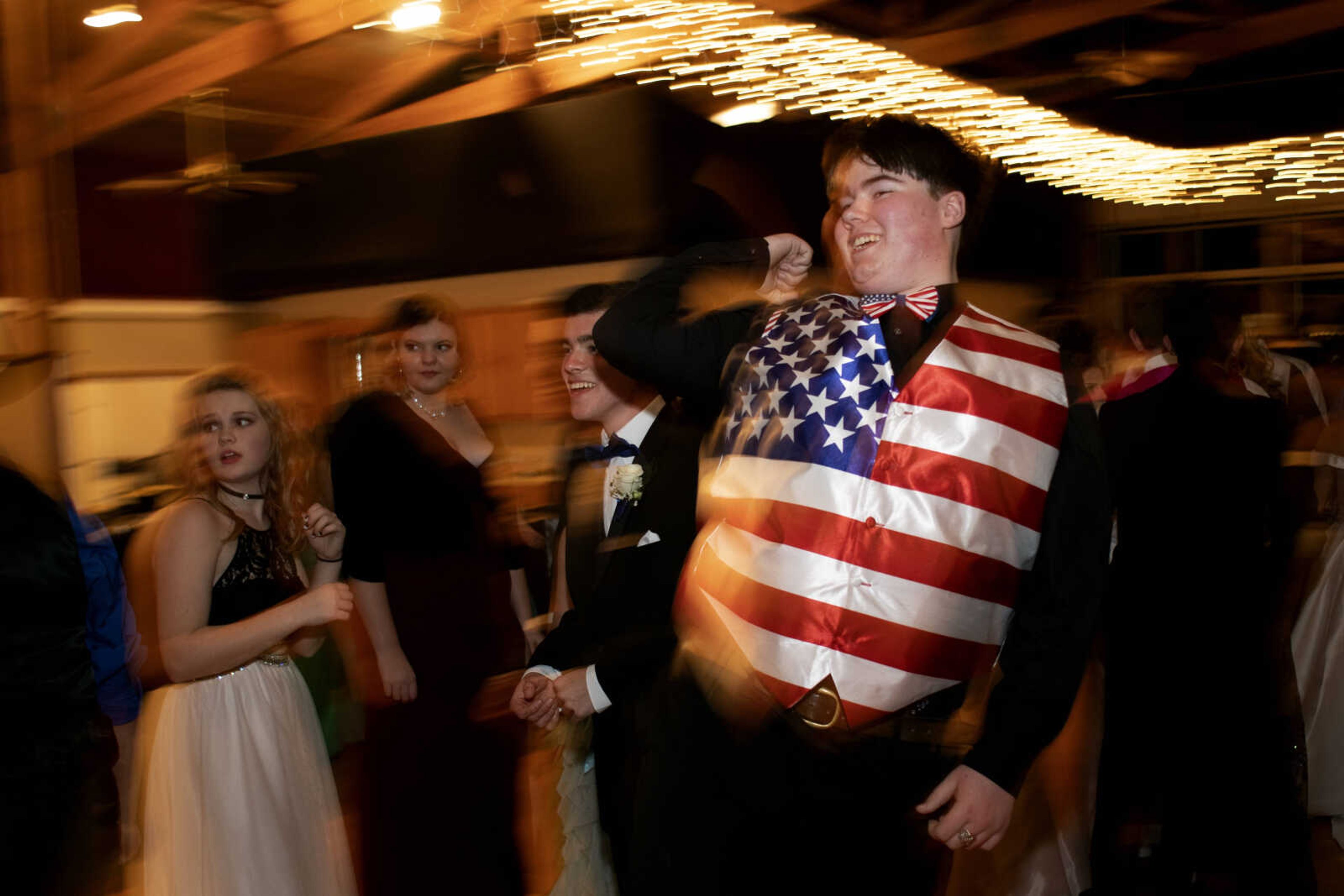 Scott City sophomore Ethan Pratt sports an American flag vest while dancing during Scott City's prom Saturday, April 6, 2019, at Deerfield Lodge in Cape Girardeau.