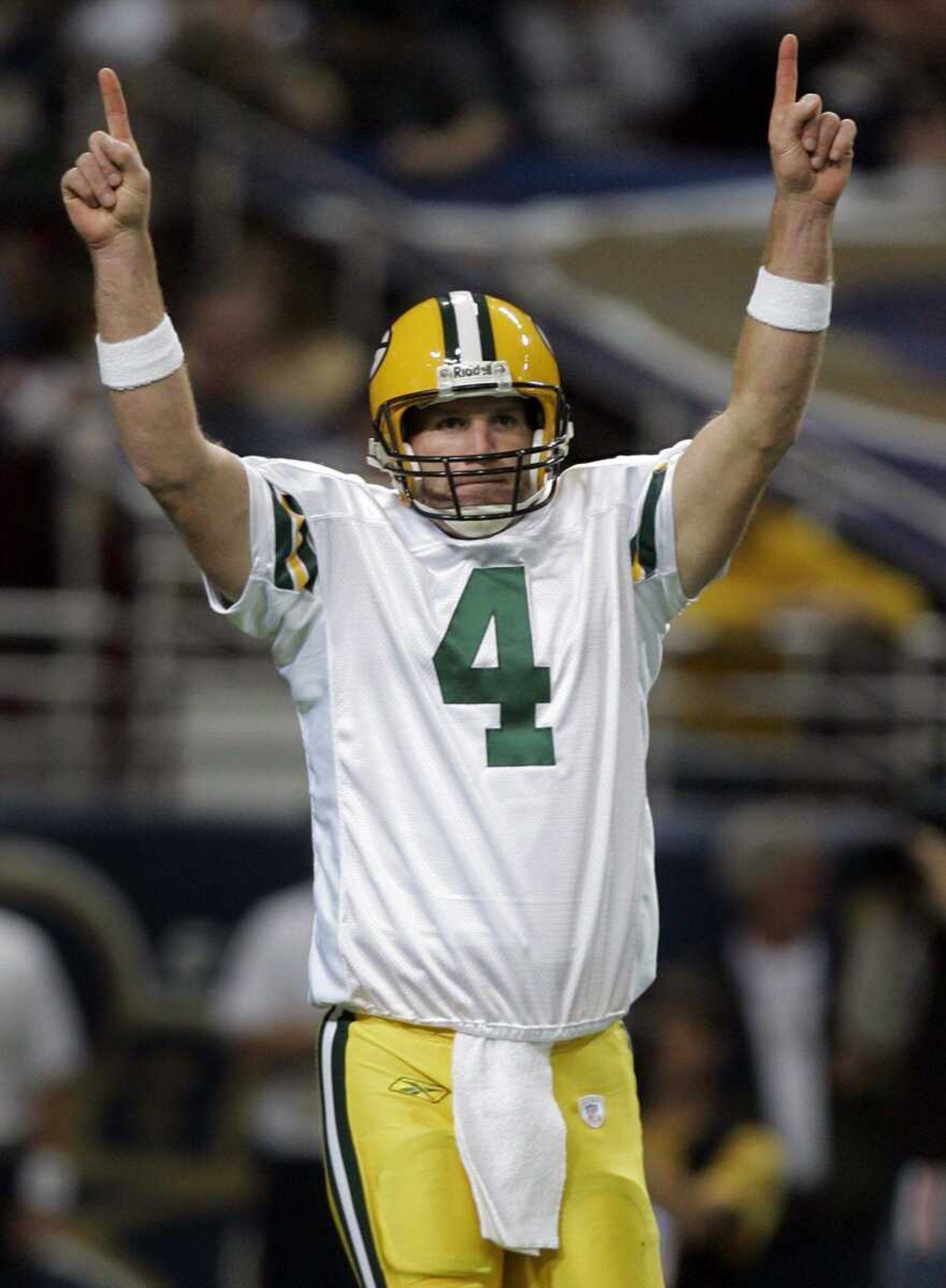 Green Bay Packers quarterback Brett Favre celebrates after throwing a 4-yard touchdown pass to Packers tight end Donald Lee during the second quarter of an NFL football game against the St. Louis Rams, Sunday, Dec. 16, 2007, in St. Louis. (AP Photo/Jeff Roberson)