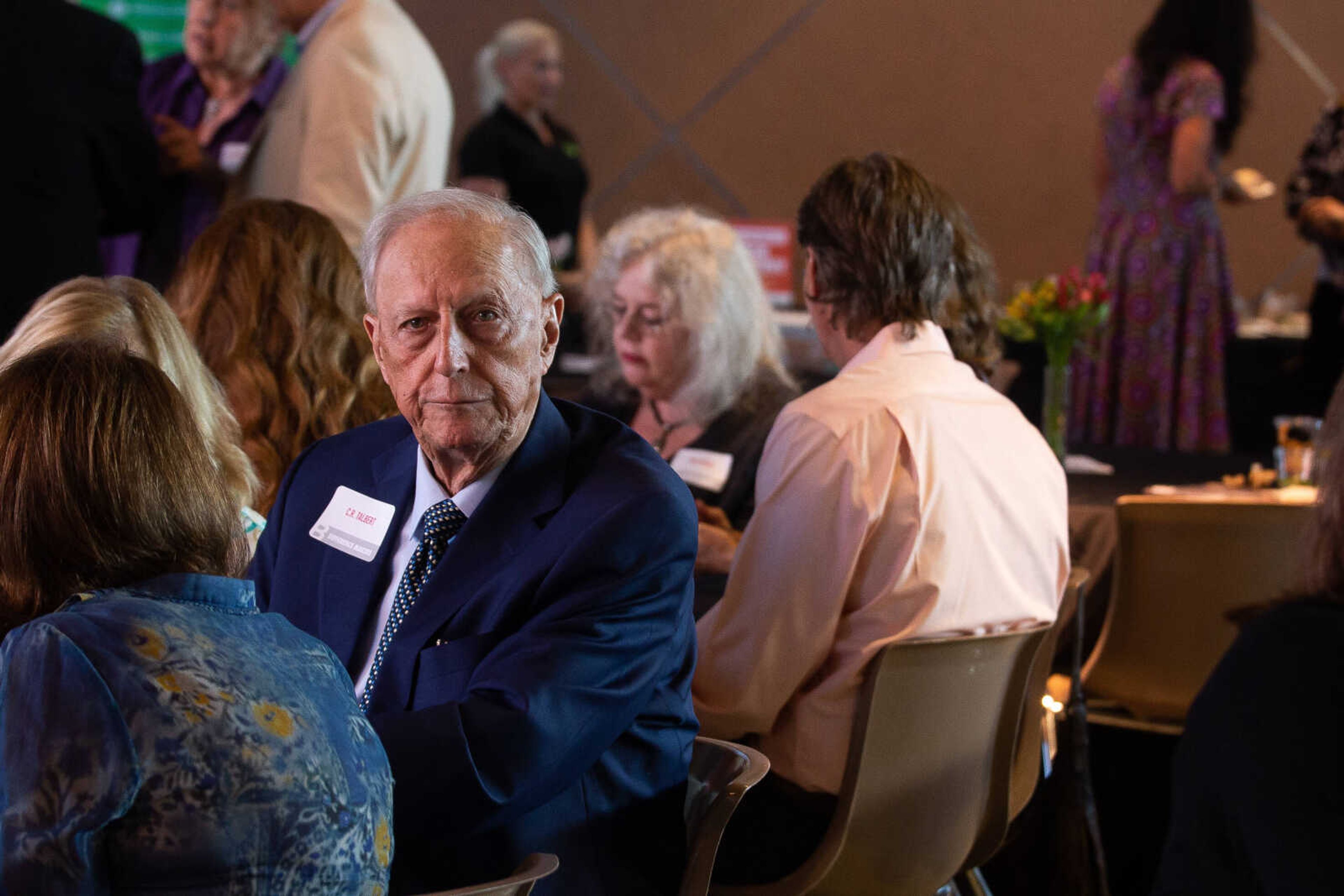 Dr. Clifford Talbert, Jr.  peers into the camera as he sits among community members during the B Magazine Difference Makers awards ceremony on Thursday, Sept. 8 at the SEMO River Campus.