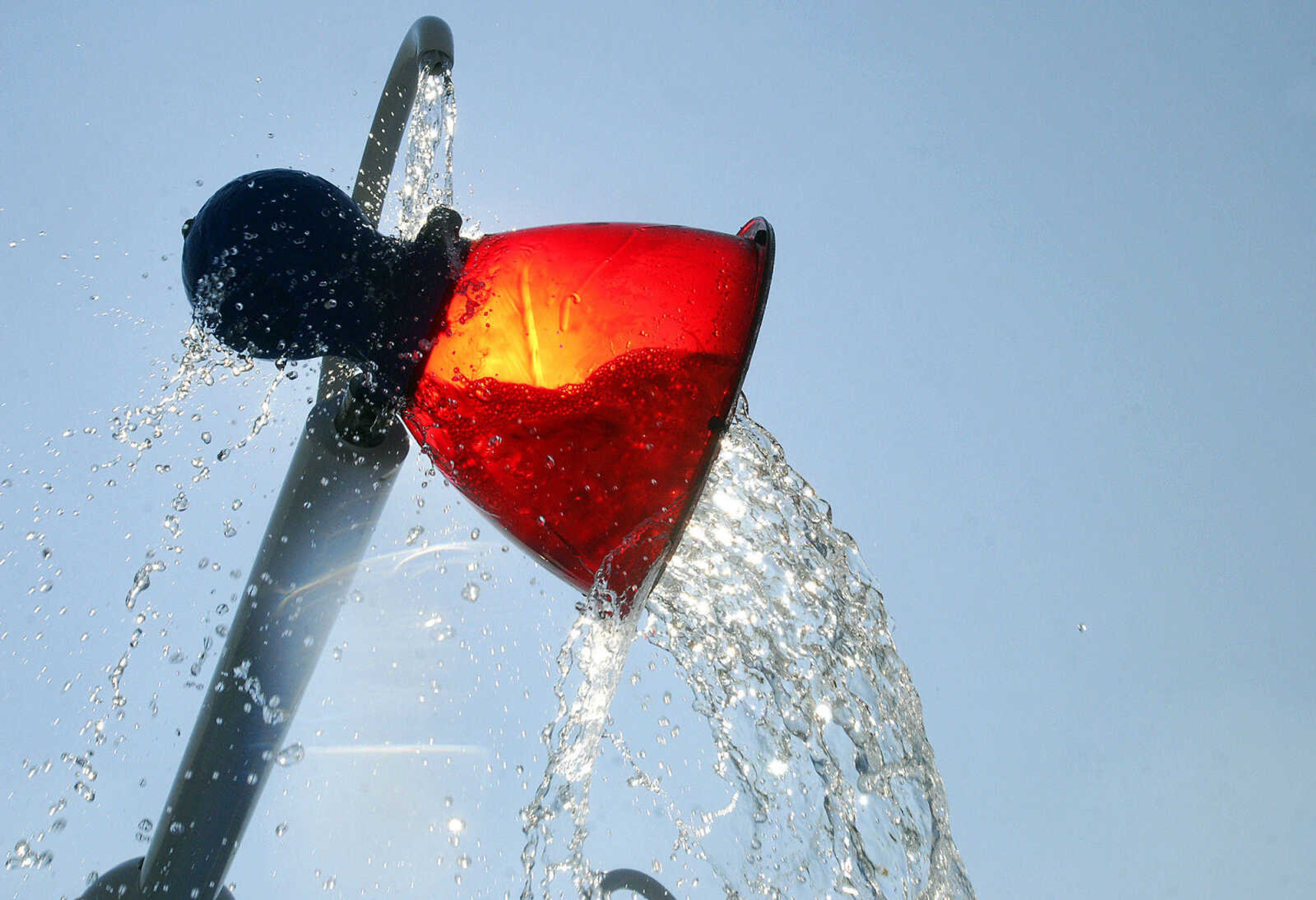 LAURA SIMON~lsimon@semissourian.com
A water bucket on the splash pad area tips over after it is filled with water Saturday, May 29, 2010 during the opening day of Cape Splash Family Auquatic Center.