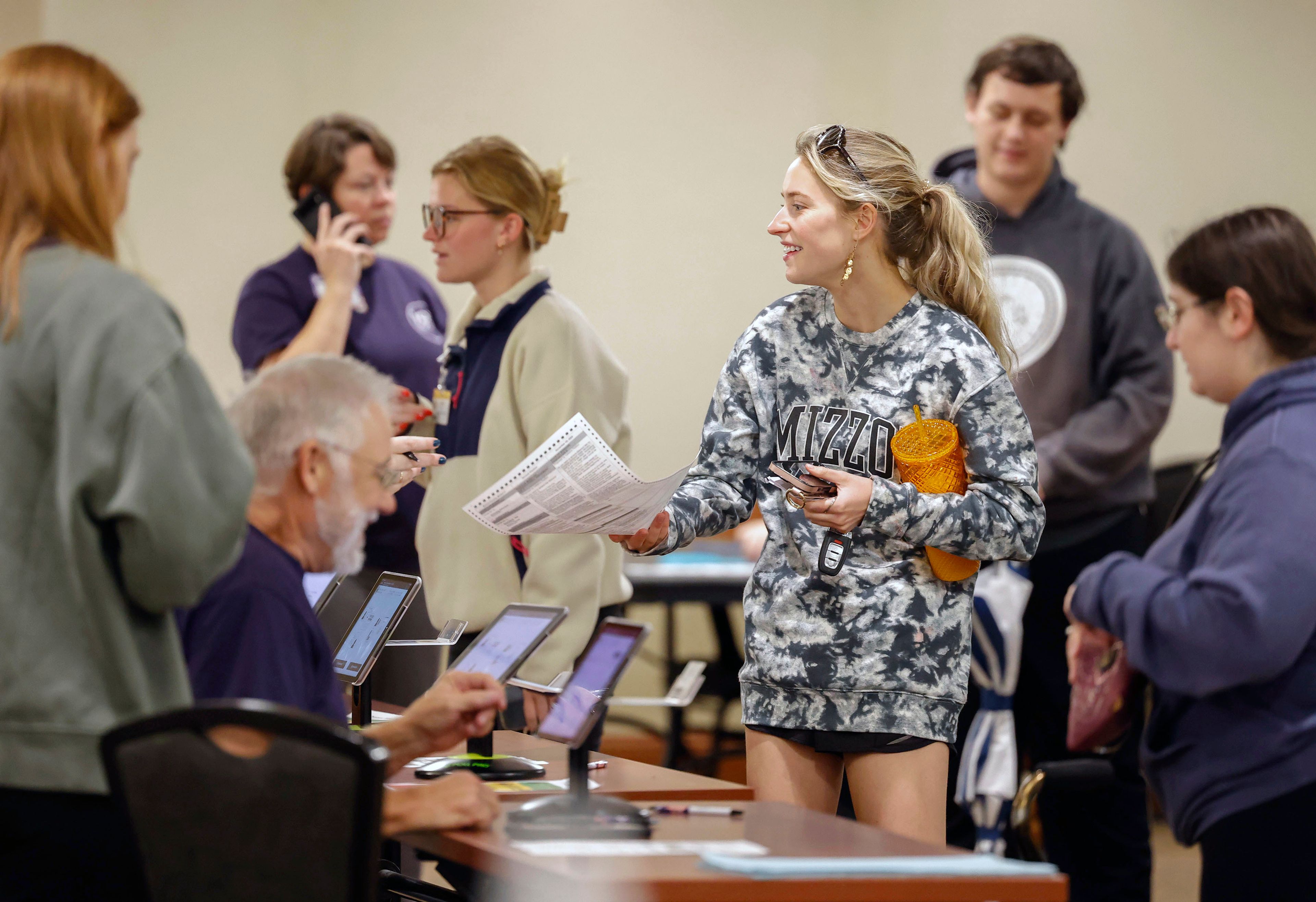 University of Missouri junior Ella Wilkins collects her ballot from an election worker on Tuesday, Nov. 5, 2024, at Memorial Union in Columbia, Mo. (Hannah Henderson/Missourian via AP)