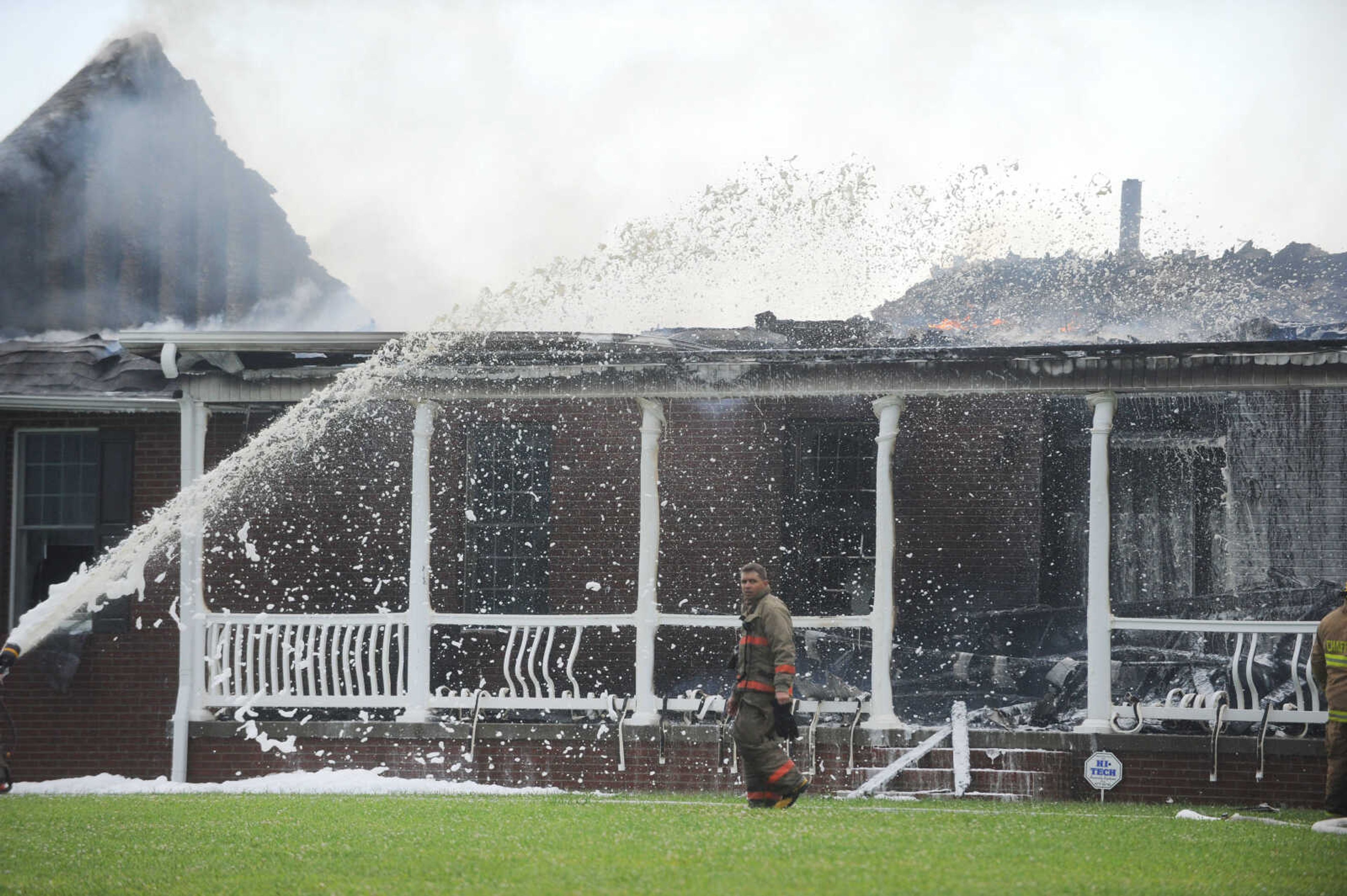 LAURA SIMON ~ lsimon@semissourian.com

Firefighters from Delta, Scott City, Chaffee and New Hamburg/Benton/Commerce battle a house fire off County Road 204 in Scott County Wednesday afternoon, July 23, 2014.