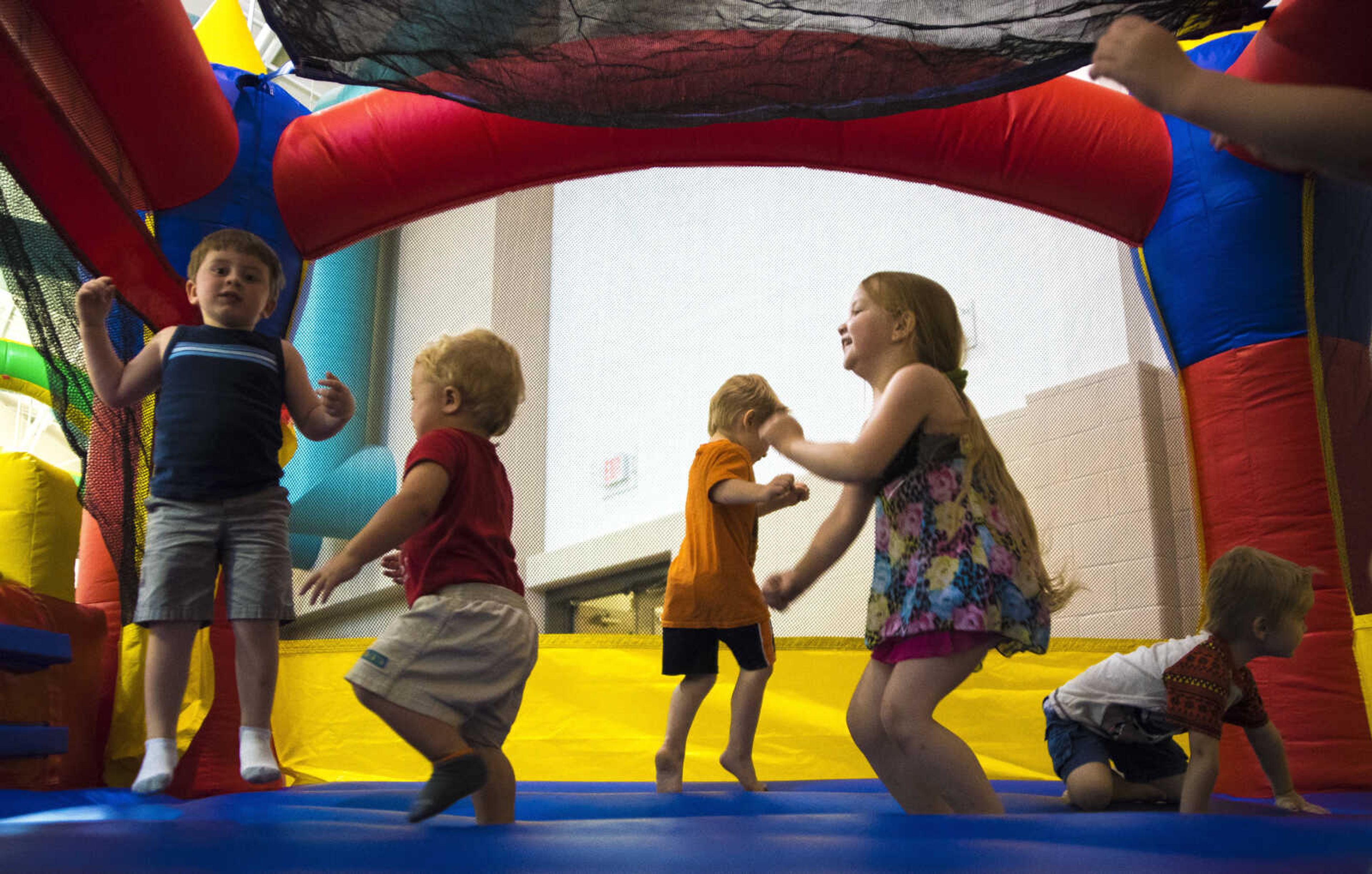 Kids jump on an inflatable during the Parks and Rec Day Friday, July 7, 2017 at the Osage Centre in Cape Girardeau.