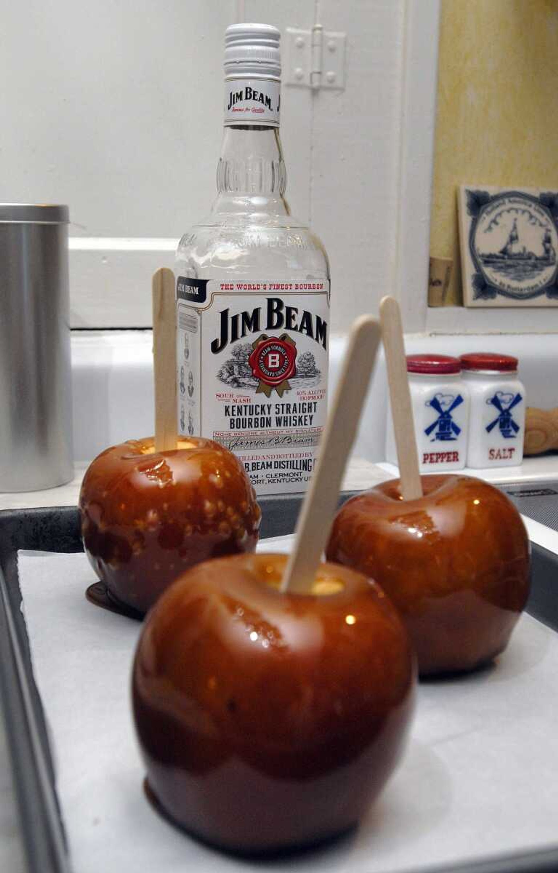 Bourbon can add a grown-up flavor to caramel apples. (Fred Lynch)