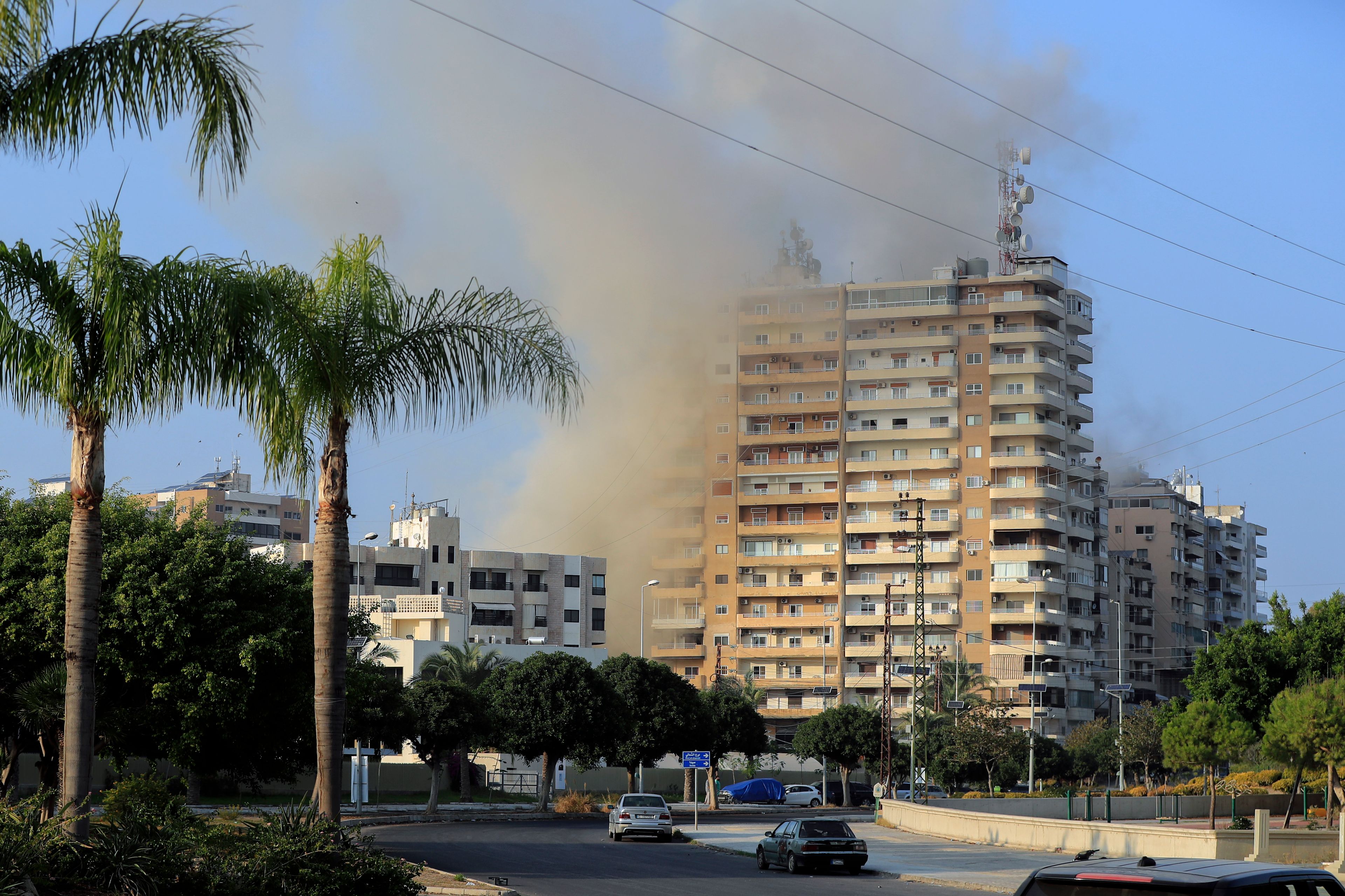 Smoke rises from buildings hit in Israeli airstrikes in Tyre, southern Lebanon, Thursday, Nov. 7, 2024. (AP Photo/Mohammed Zaatari)