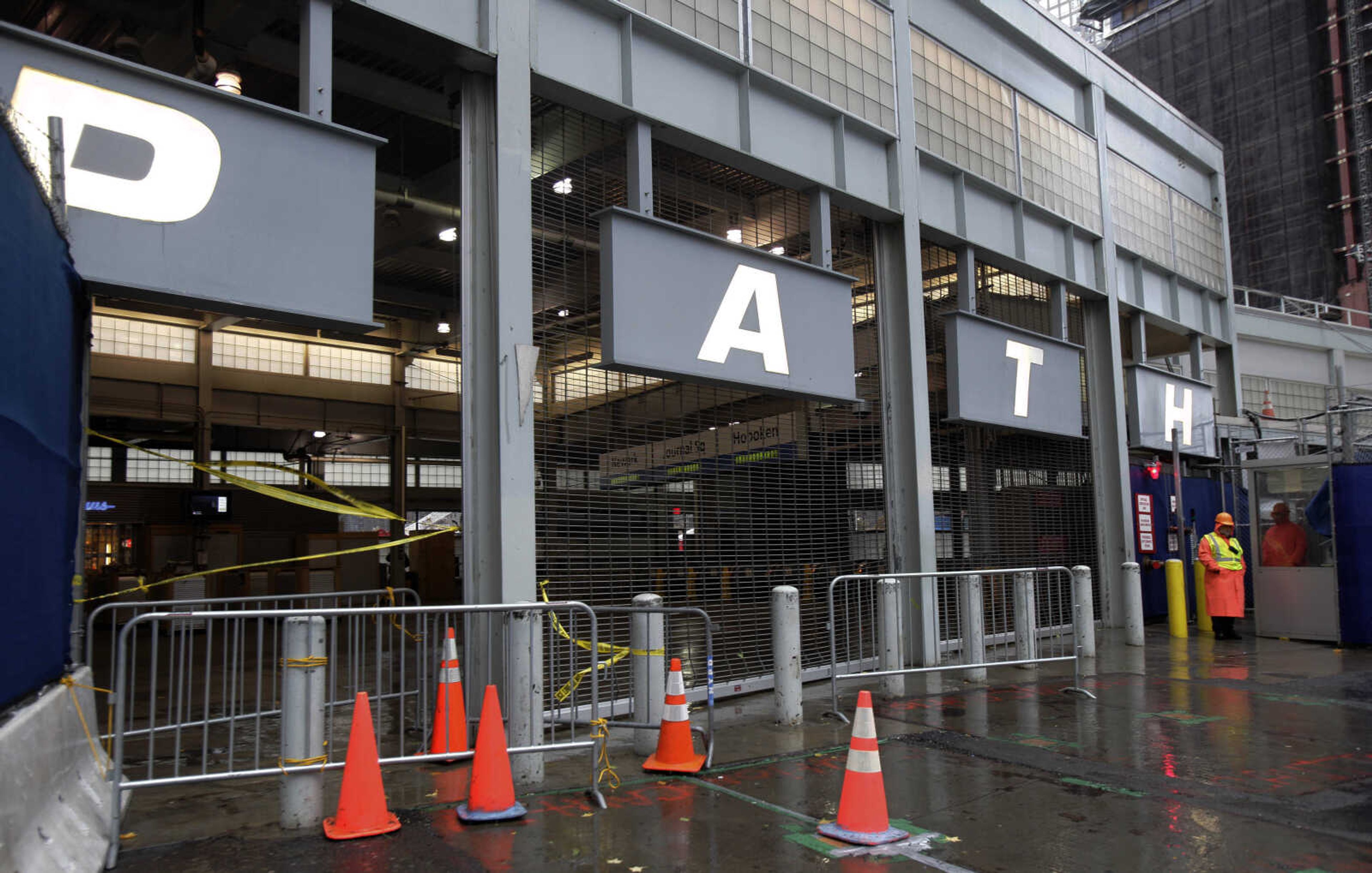 The PATH railroad station at the World Trade Center site is closed by weather, in New York,  Monday, Oct. 29, 2012. Hurricane Sandy continued on its path Monday, as the storm forced the shutdown of mass transit, schools and financial markets, sending coastal residents fleeing, and threatening a dangerous mix of high winds and soaking rain.  (AP Photo/Richard Drew)