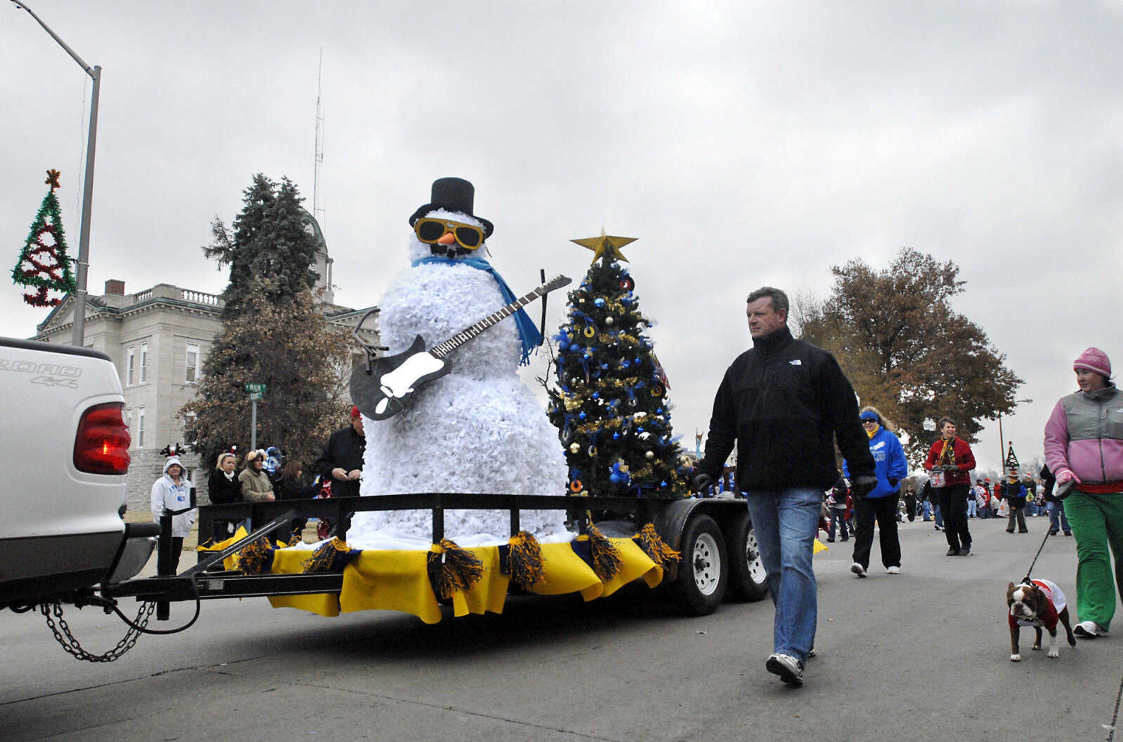 KRISTIN EBERTS ~ keberts@semissourian.com

The Immaculate Conception School's Christmas Spirit Award-winning float passes the courthouse during the Jackson Christmas Parade on Saturday, Dec. 4, 2010, in downtown Jackson.